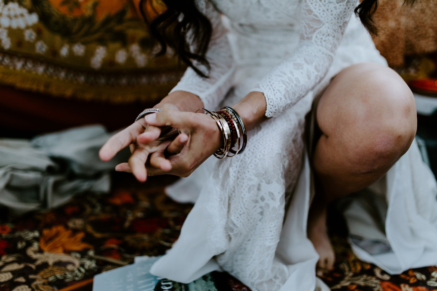 Emerald puts on her jewelry for her elopement.