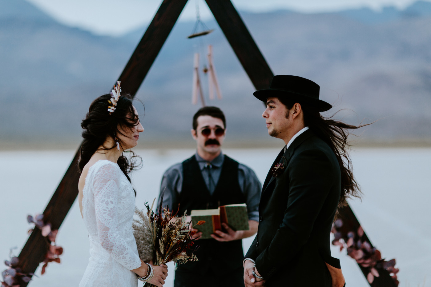 Cameron and Emerland face each other during their elopement ceremony.