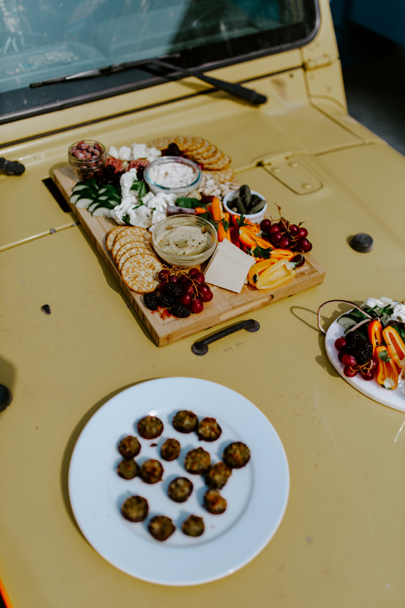 The appetizers sit on a jeep.