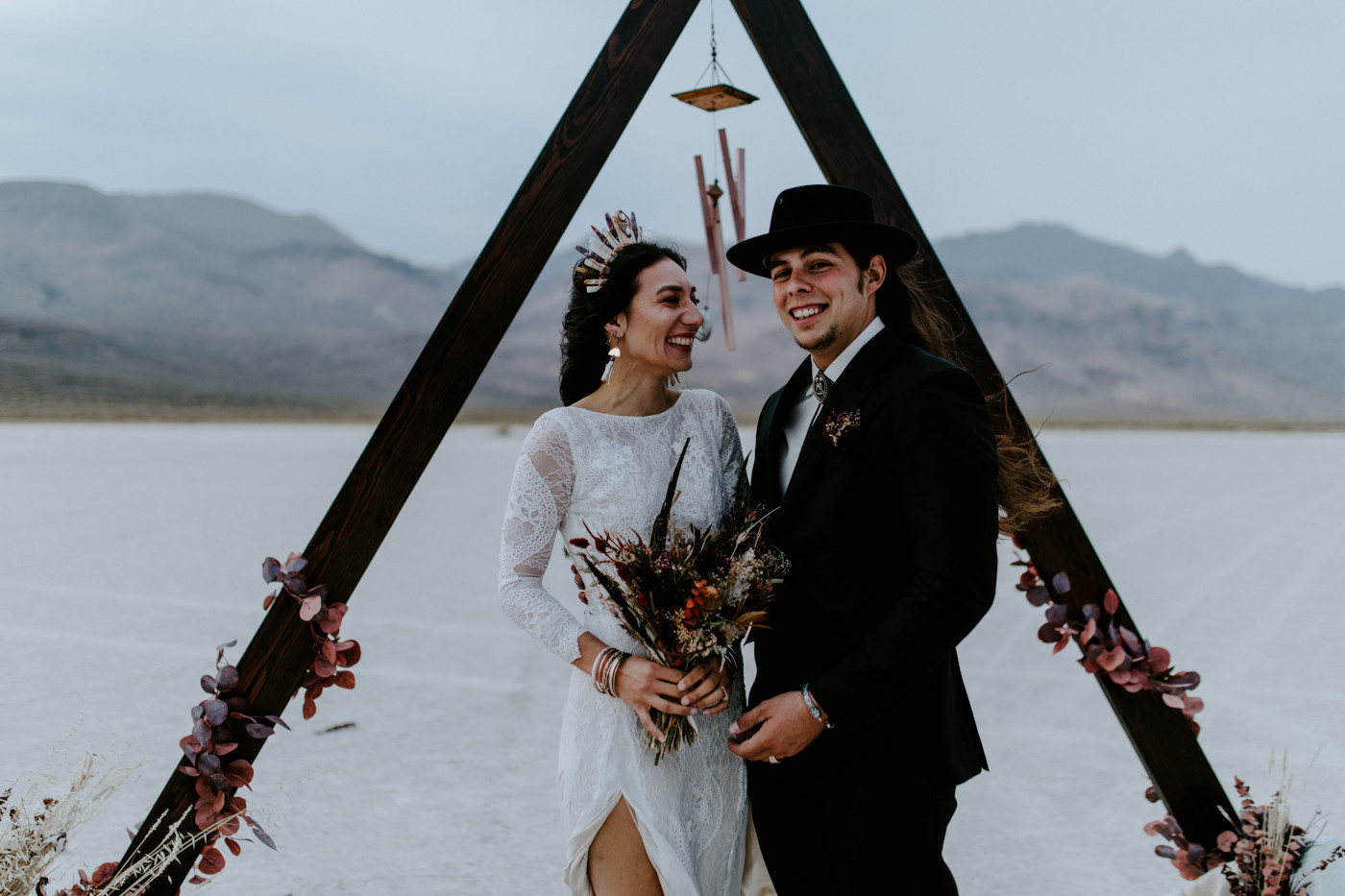 Emerald and Cameron smile standing at the Altar.