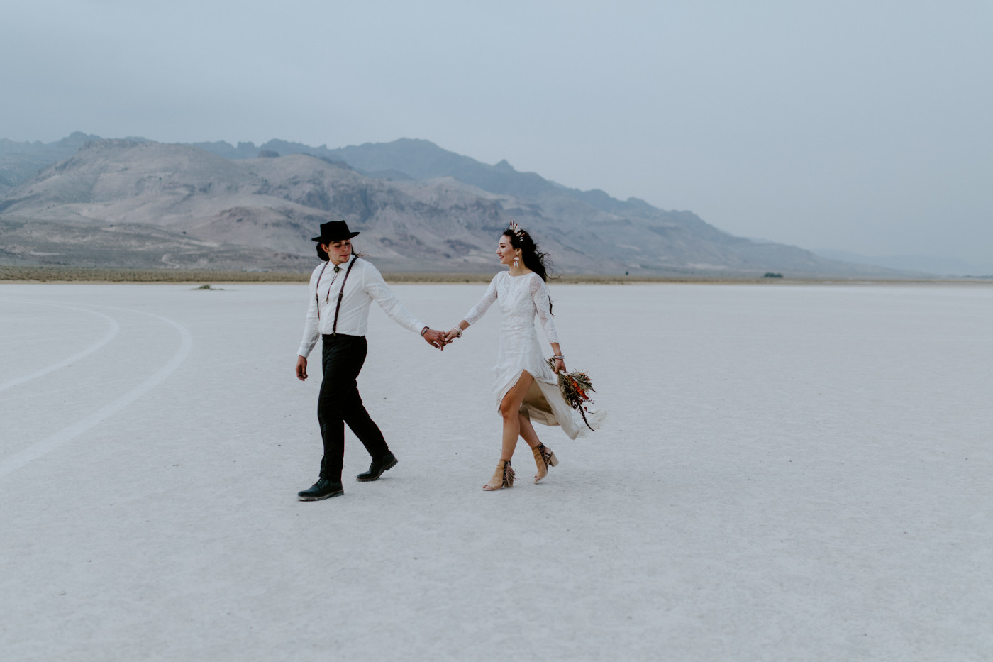 Emerald and Cameron walk throug the Alvord Desert in Central Oregon.