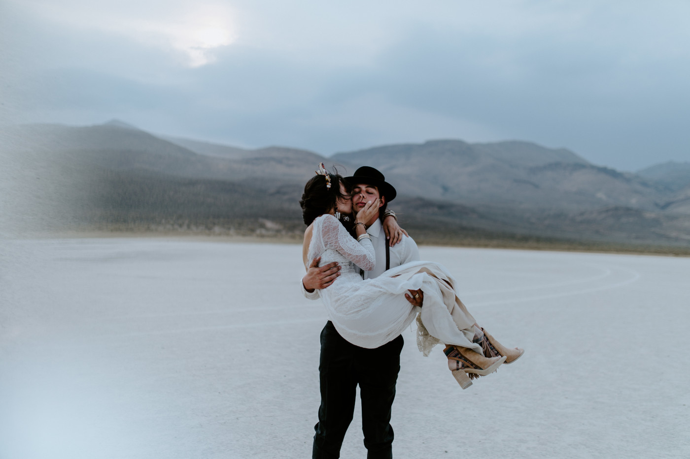 Cameron holds Emerald while standing in the Alvord Desert.