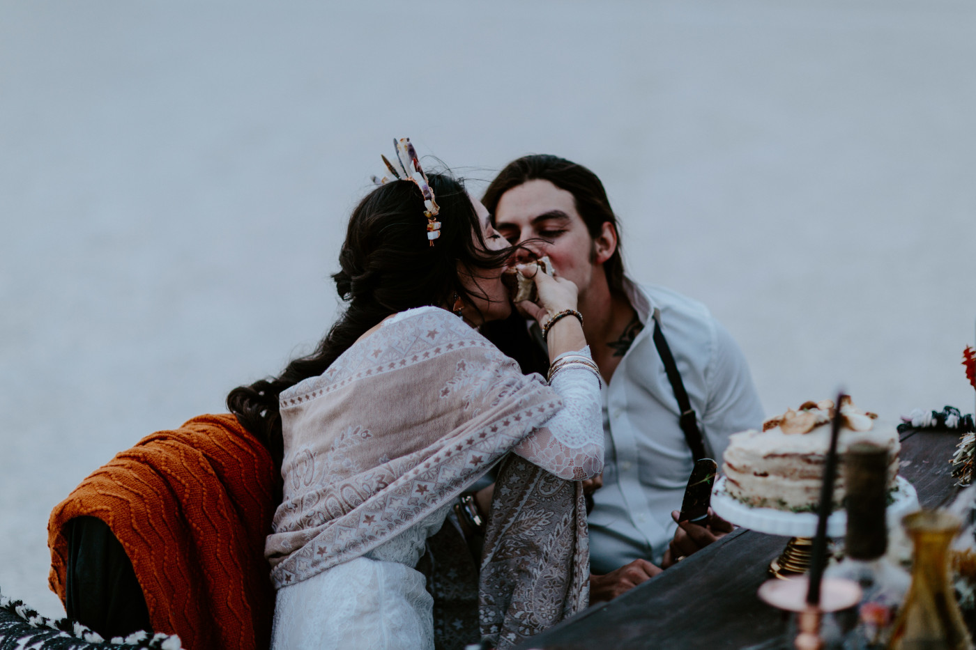 Cameron and Emerald share a piece of the cake.