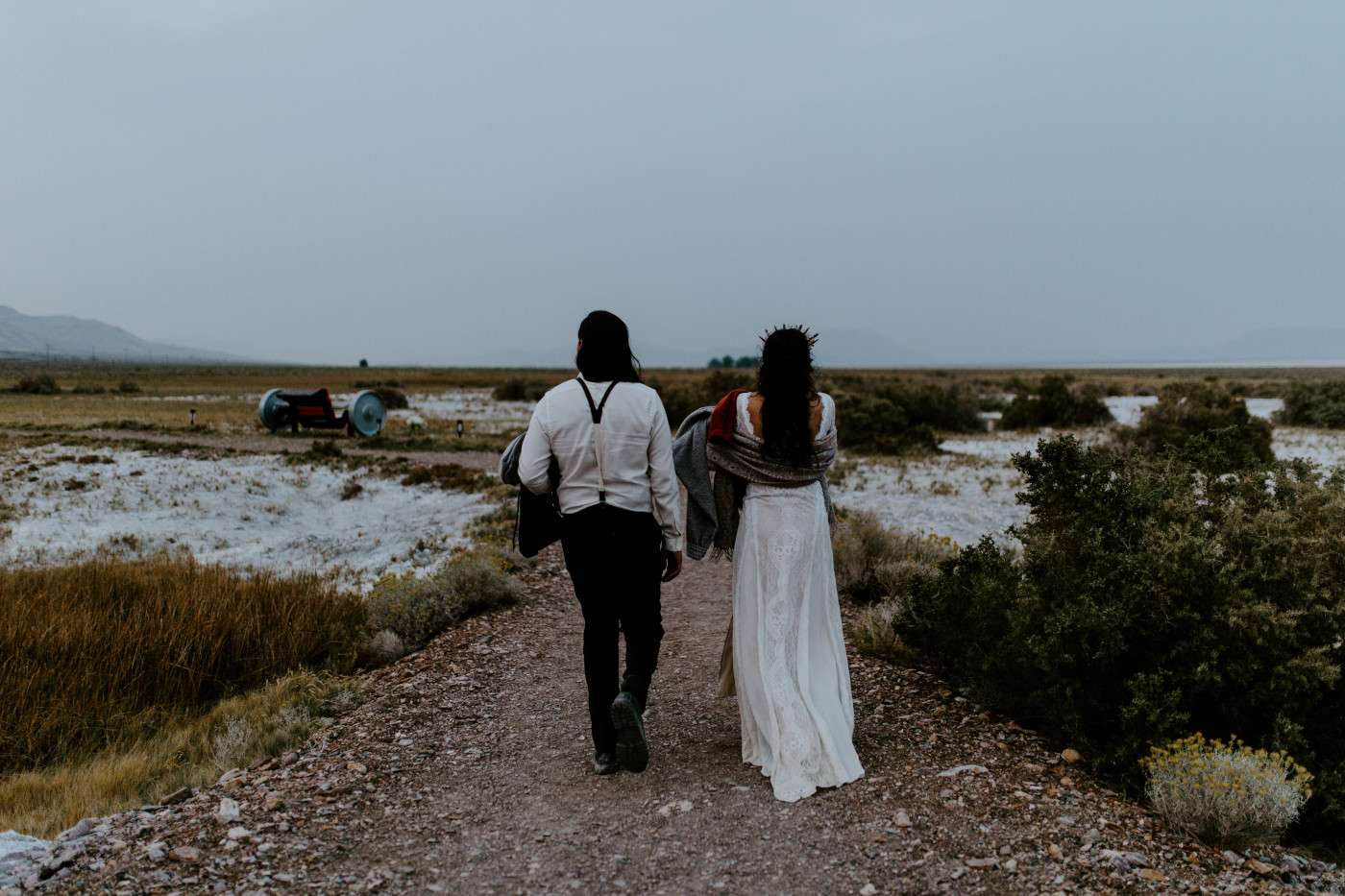 Emerald and Cameron walk toward the natural springs in the Alvord Desert.