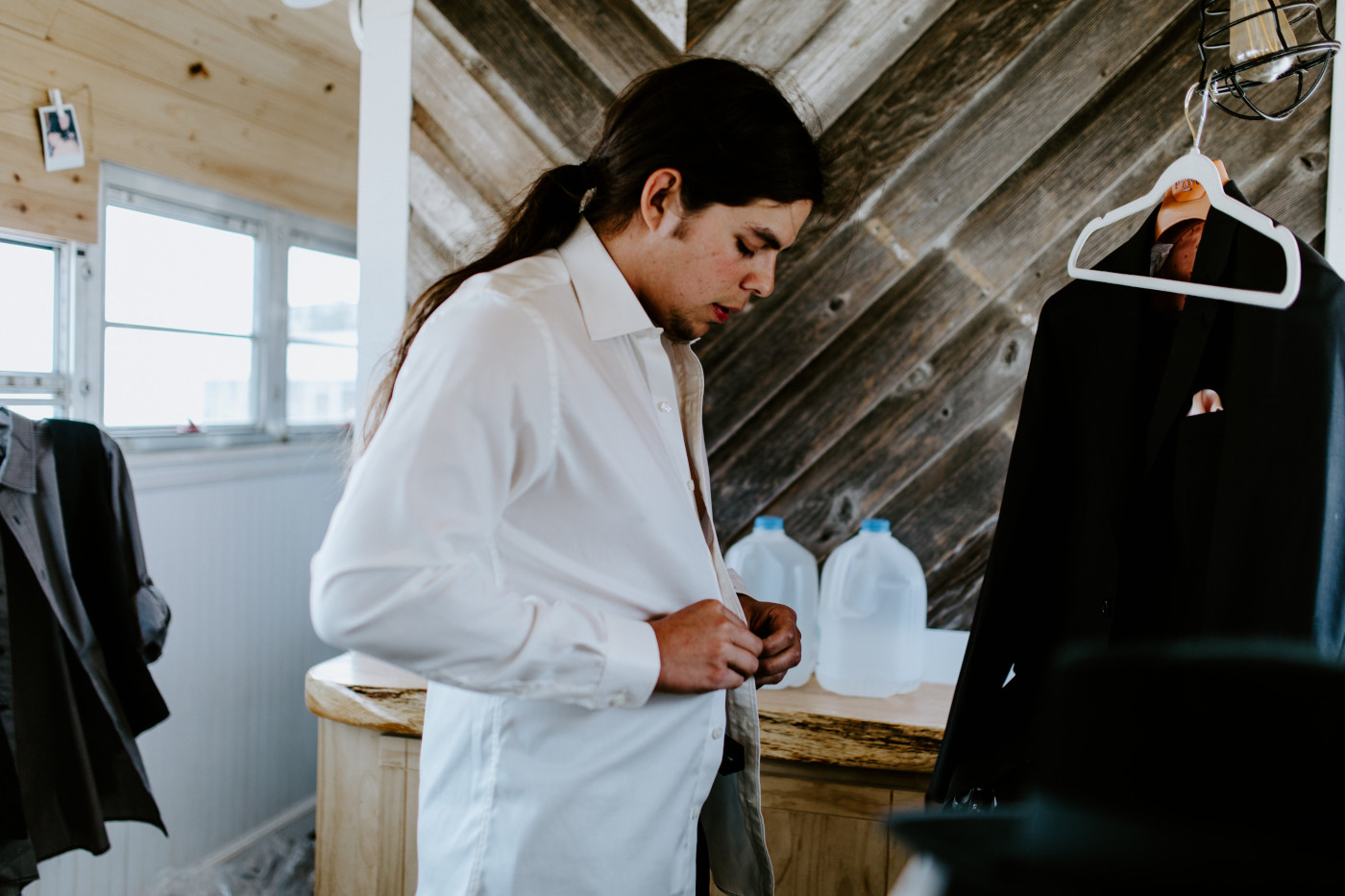 Cameron dresses for his elopement in the Alvord Desert.