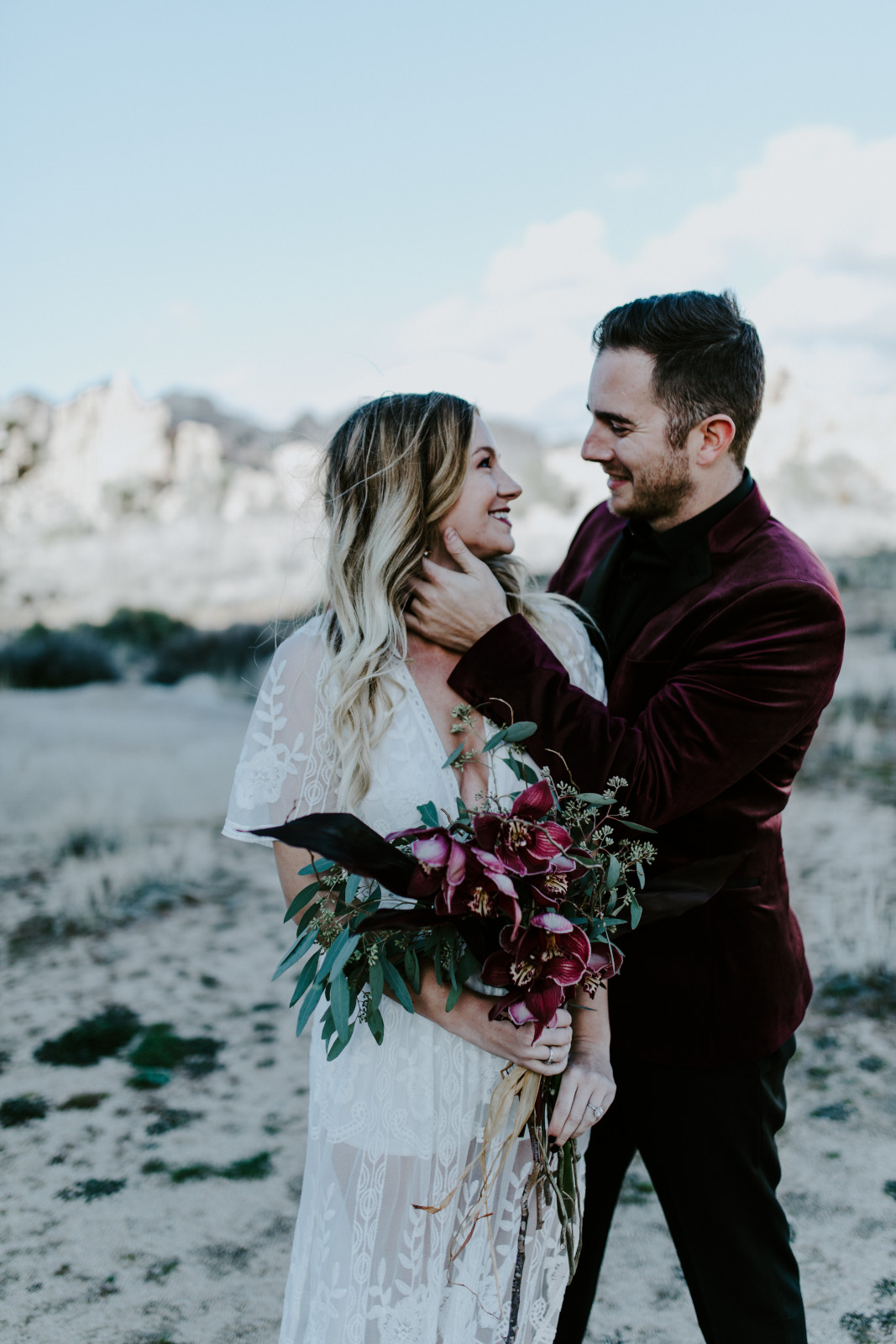 Alyssa and Jeremy stand side by side at Joshua Tree National Park. Elopement wedding photography at Joshua Tree National Park by Sienna Plus Josh.