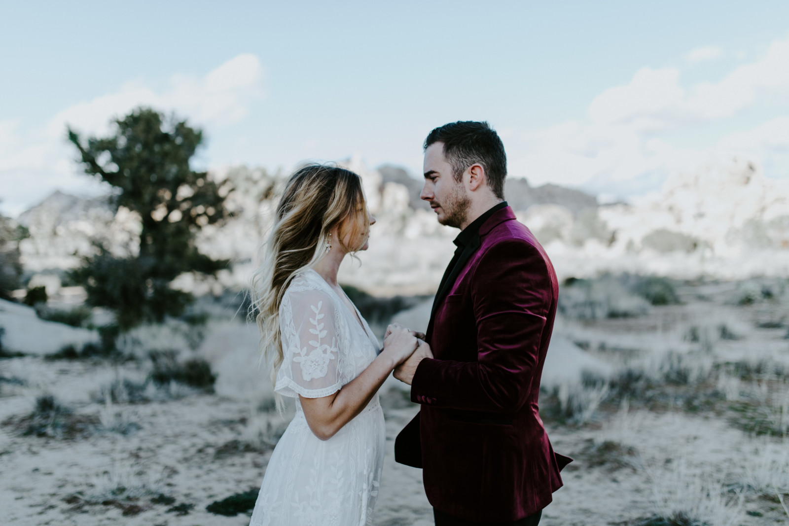 Jeremy holds Alyssa. Elopement wedding photography at Joshua Tree National Park by Sienna Plus Josh.