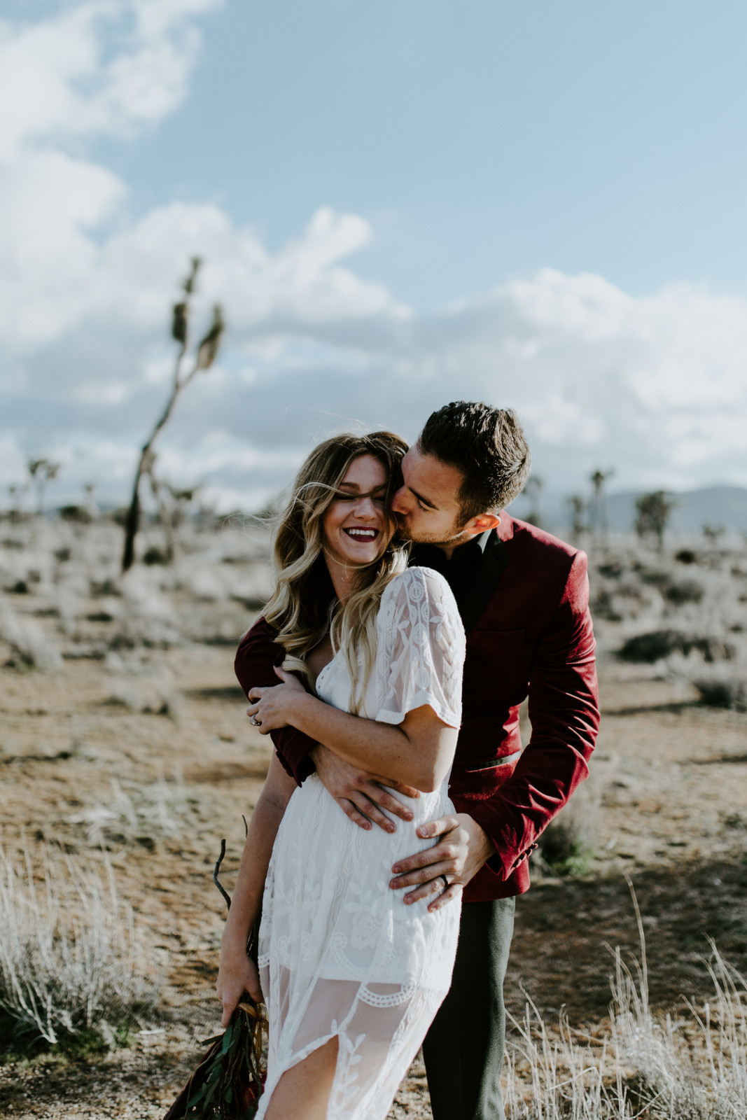 Alyssa and Jeremy walk through Joshua Tree National Park, CA Elopement wedding photography at Joshua Tree National Park by Sienna Plus Josh.