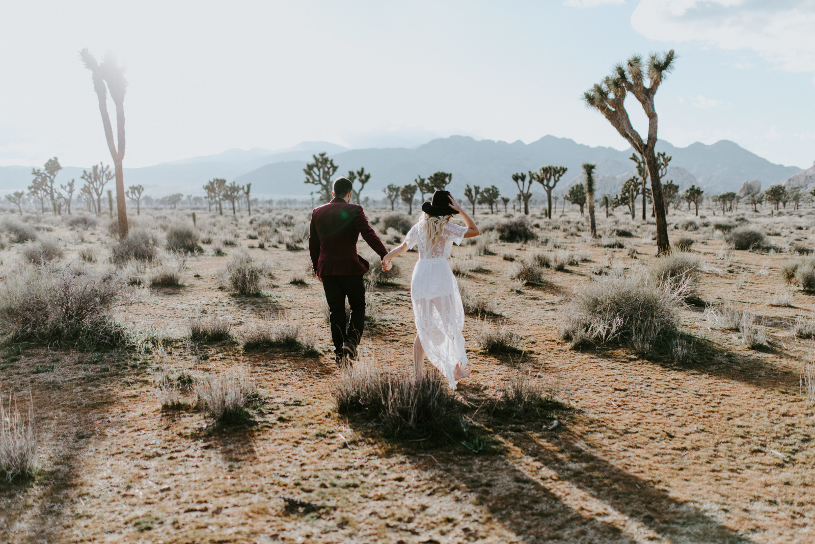 Jeremy and Alyssa stroll through Joshua Tree National Park. Elopement wedding photography at Joshua Tree National Park by Sienna Plus Josh.