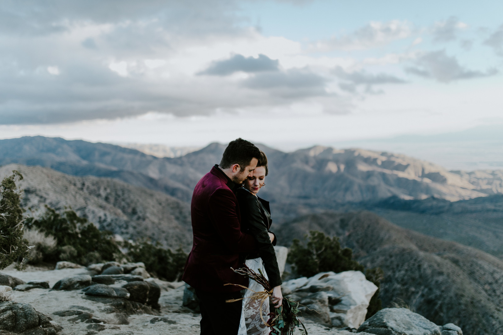 Jeremy holds Alyssa at Joshua Tree National Park, CA Elopement wedding photography at Joshua Tree National Park by Sienna Plus Josh.