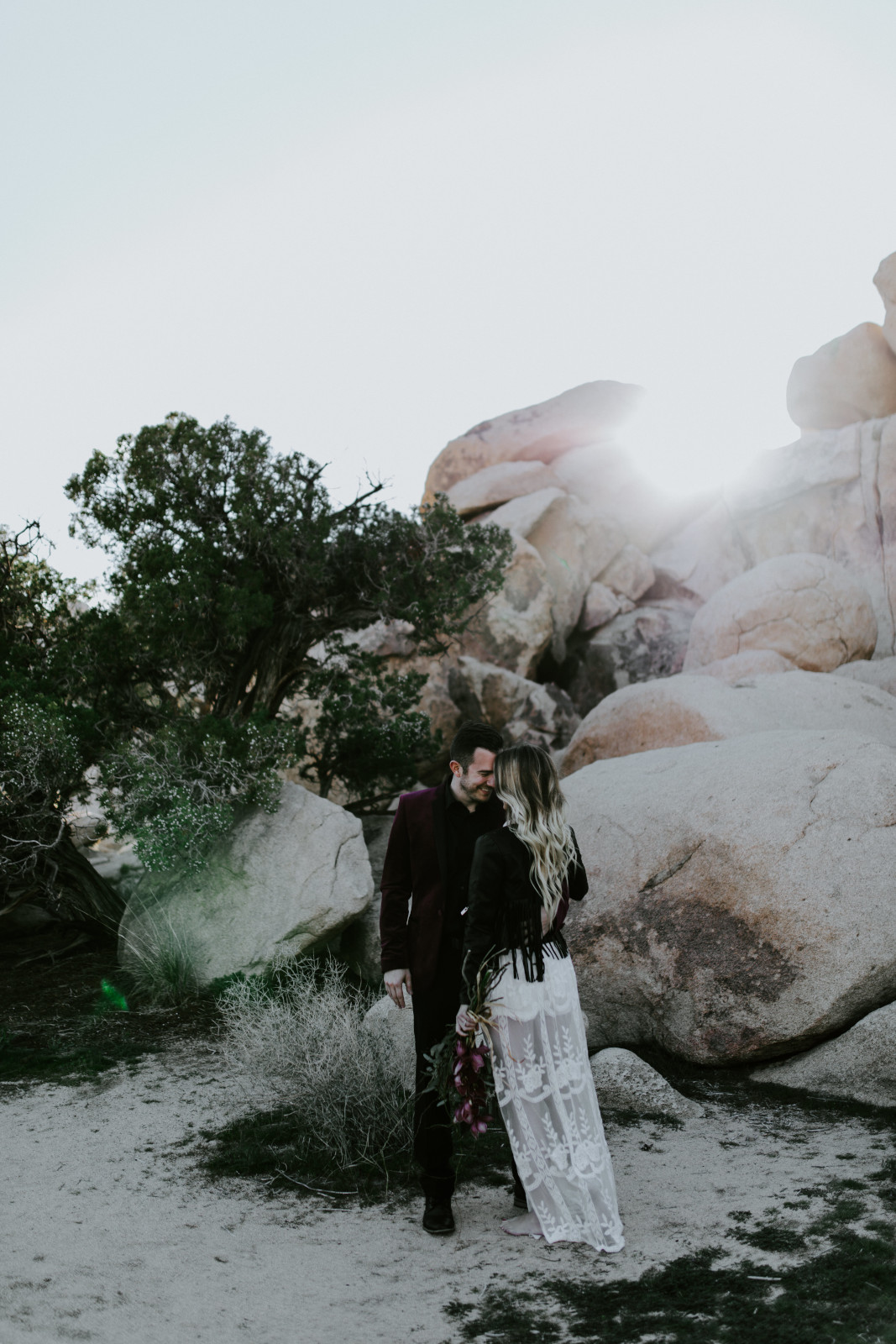 Jeremy and Alyssa on the trail to Joshua Tree National Park. Elopement wedding photography at Joshua Tree National Park by Sienna Plus Josh.