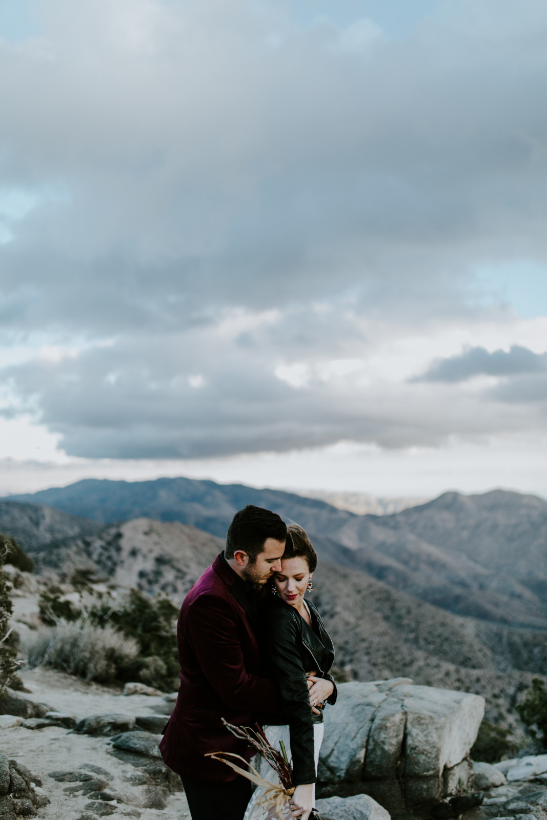 Jeremy and Alyssa hug. Elopement wedding photography at Joshua Tree National Park by Sienna Plus Josh.