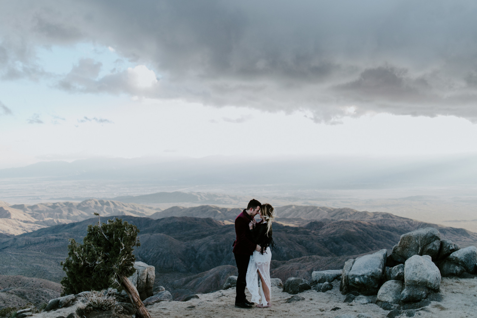 Jeremy kisses Alyssa at Joshua Tree National Park, CA Elopement wedding photography at Joshua Tree National Park by Sienna Plus Josh.
