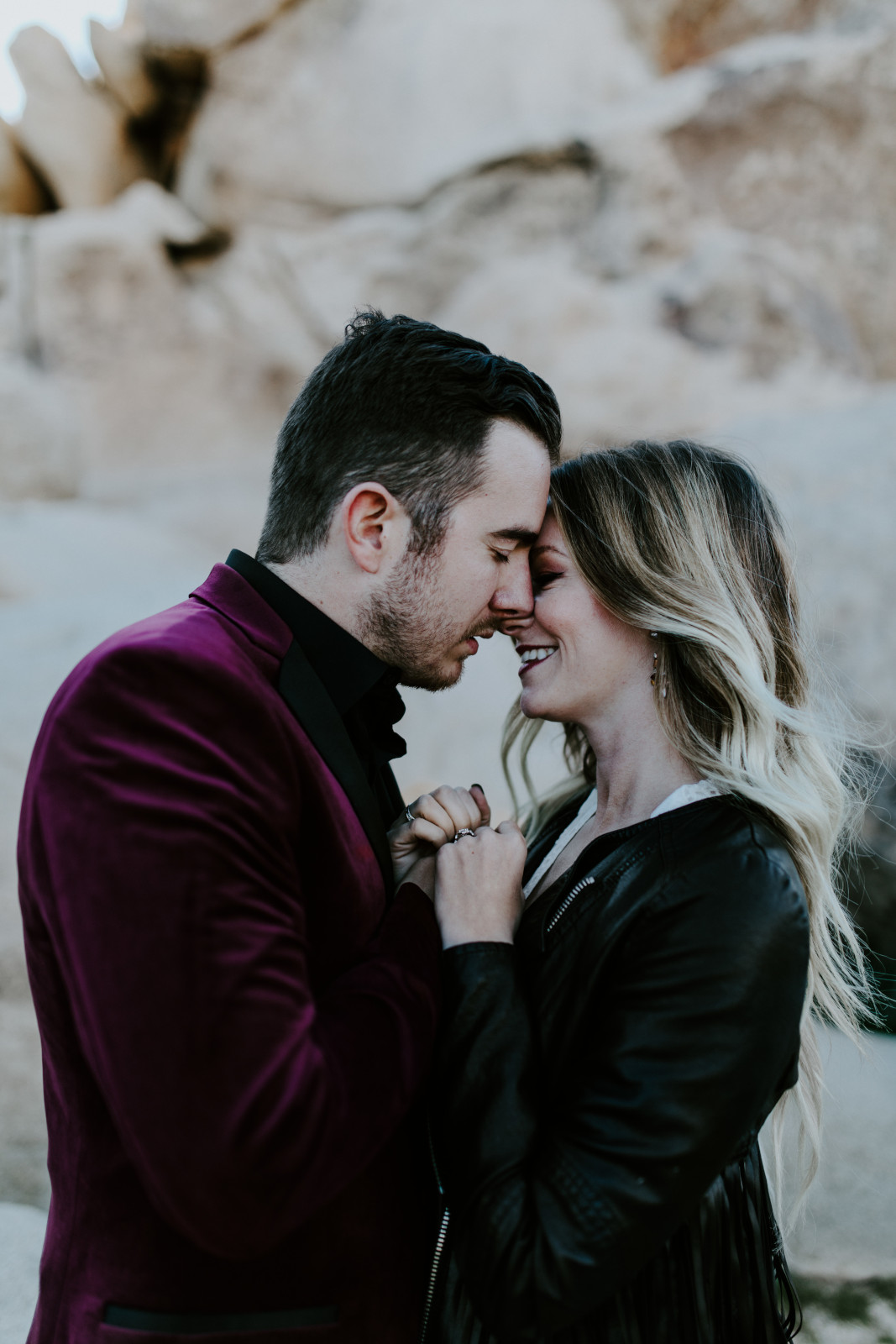 Alyssa and Jeremy go in for a kiss. Elopement wedding photography at Joshua Tree National Park by Sienna Plus Josh.