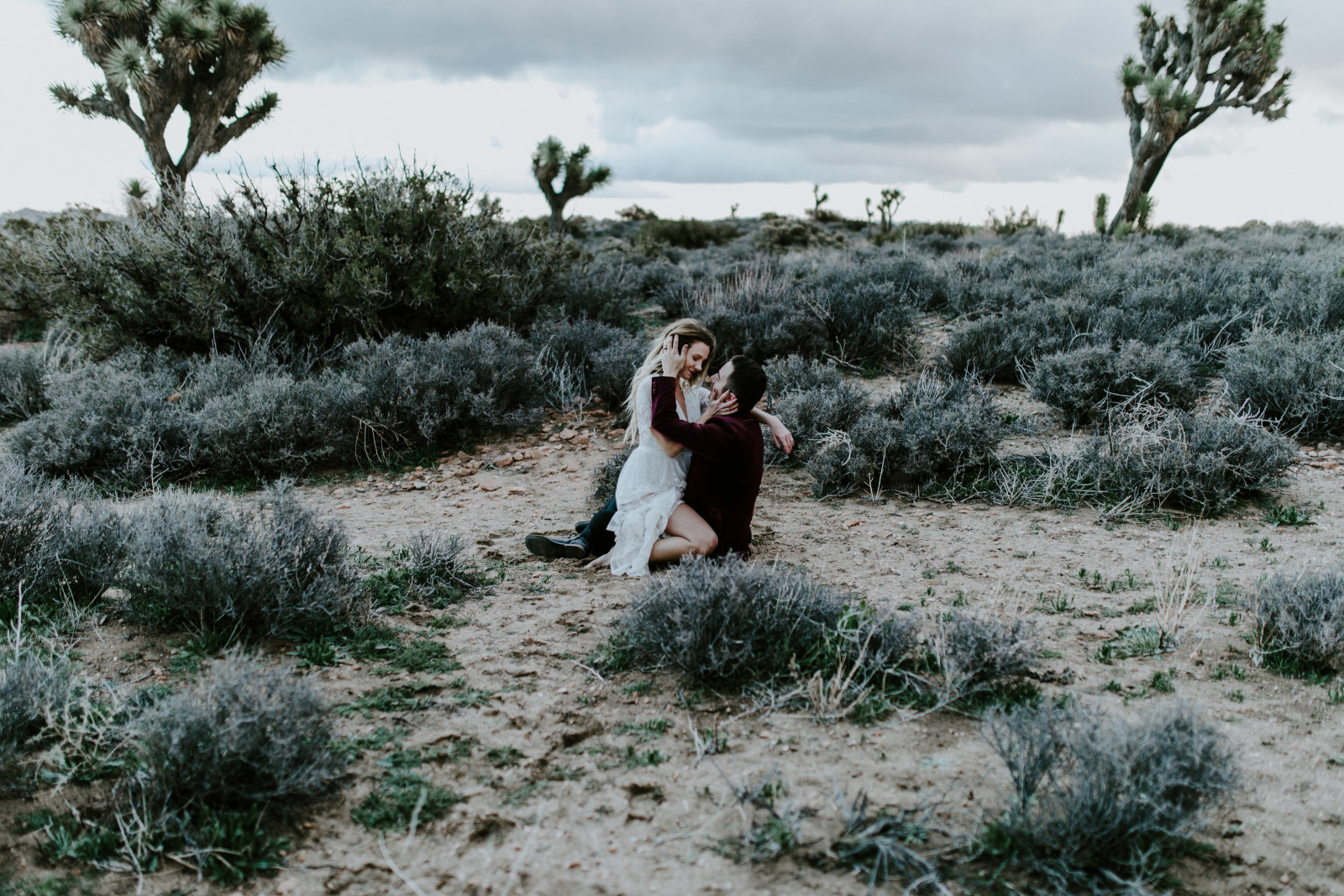 Alyssa and Jeremy reflecting at Joshua Tree. Elopement wedding photography at Joshua Tree National Park by Sienna Plus Josh.