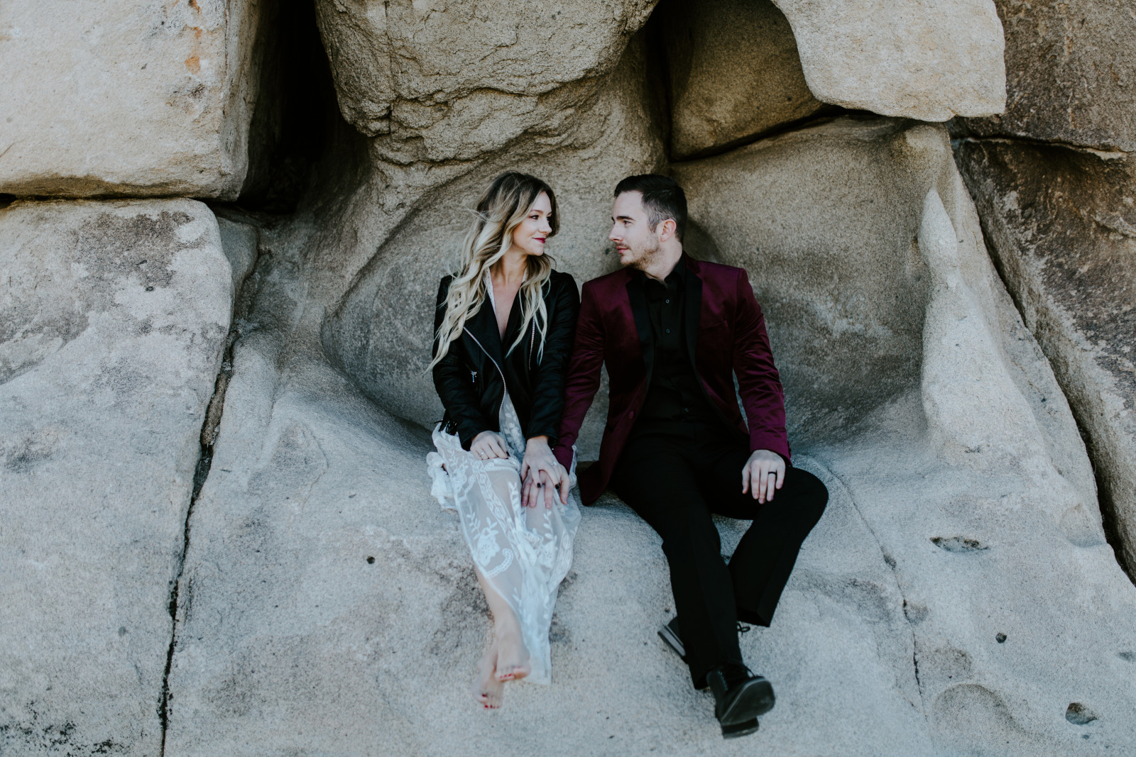 Jeremy and Alyssa sit along the trail at Joshua Tree National Park. Elopement wedding photography at Joshua Tree National Park by Sienna Plus Josh.