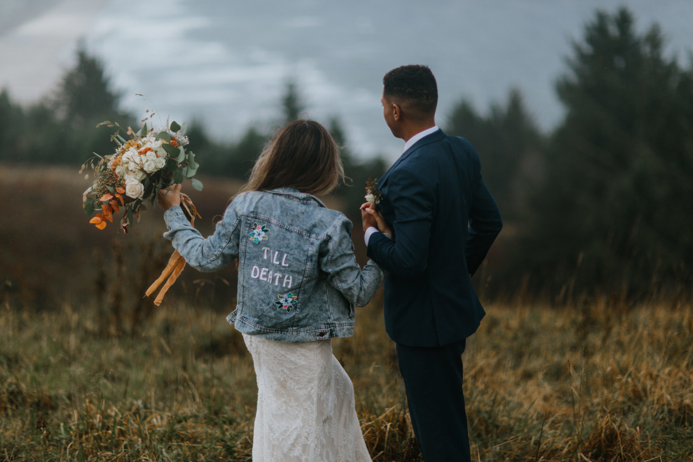 Margaux and Ariana look out at the view. Elopement photography at Mount Hood by Sienna Plus Josh.