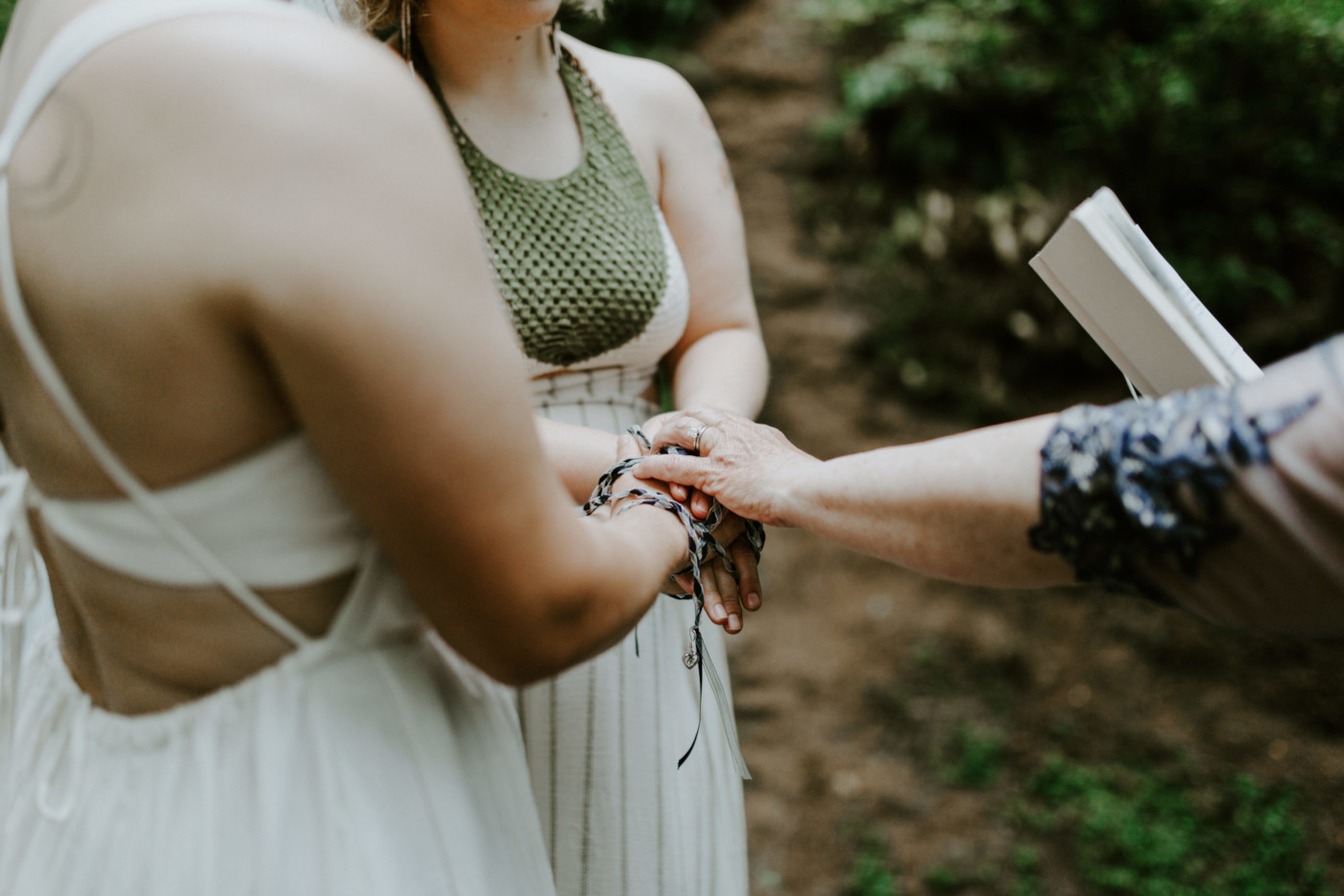 Audrey, Kate, and Kate's mom stand with their hands together. Elopement wedding photography at Bridal Veil Falls by Sienna Plus Josh.