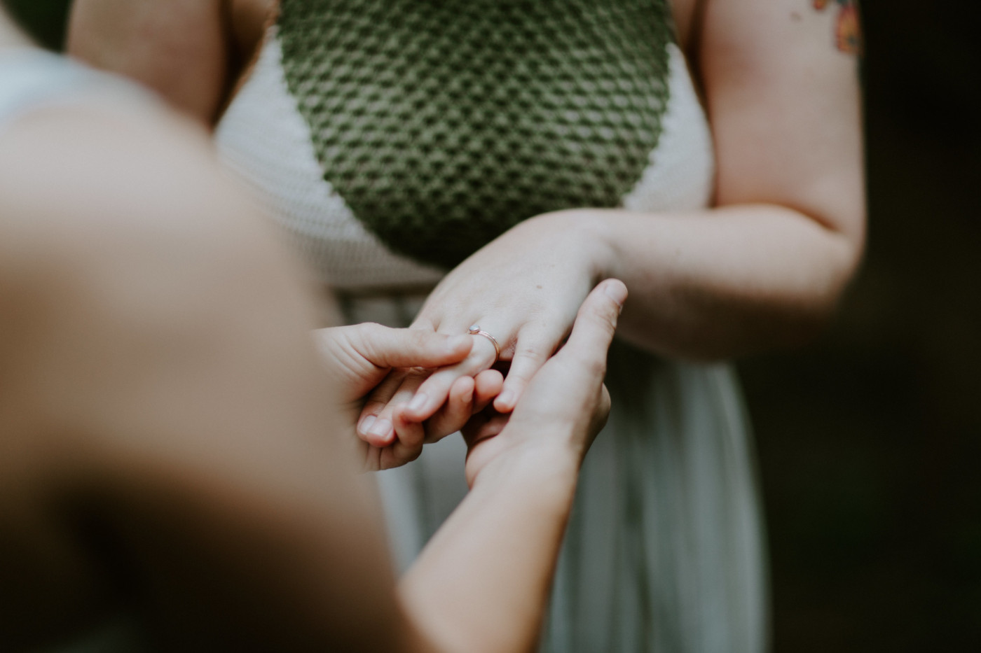 Audrey puts a ring on Kate. Elopement wedding photography at Bridal Veil Falls by Sienna Plus Josh.