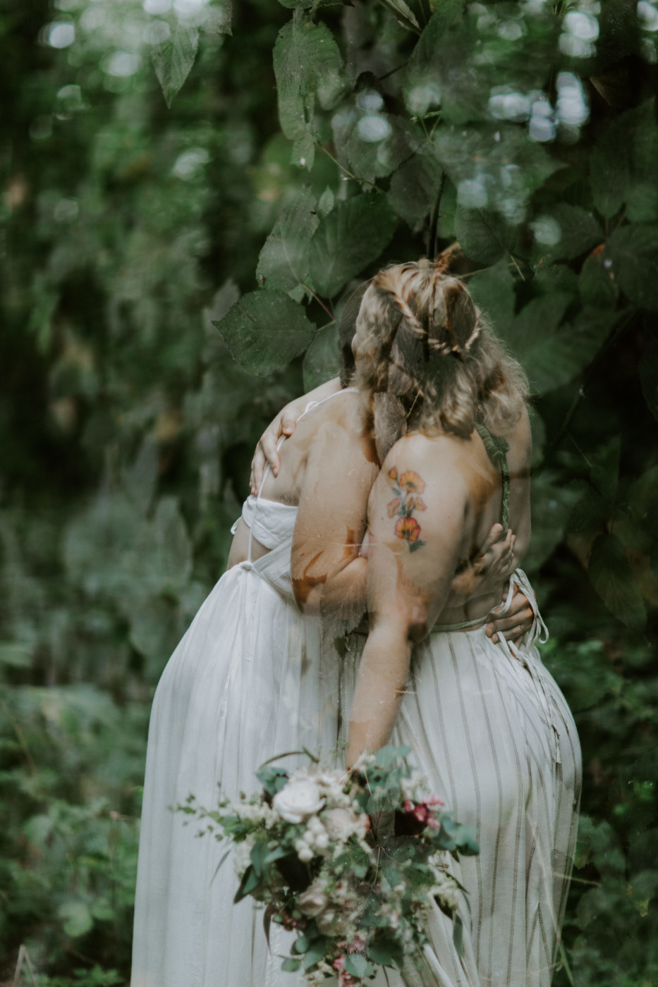 Kate and Audrey hug. Elopement wedding photography at Bridal Veil Falls by Sienna Plus Josh.