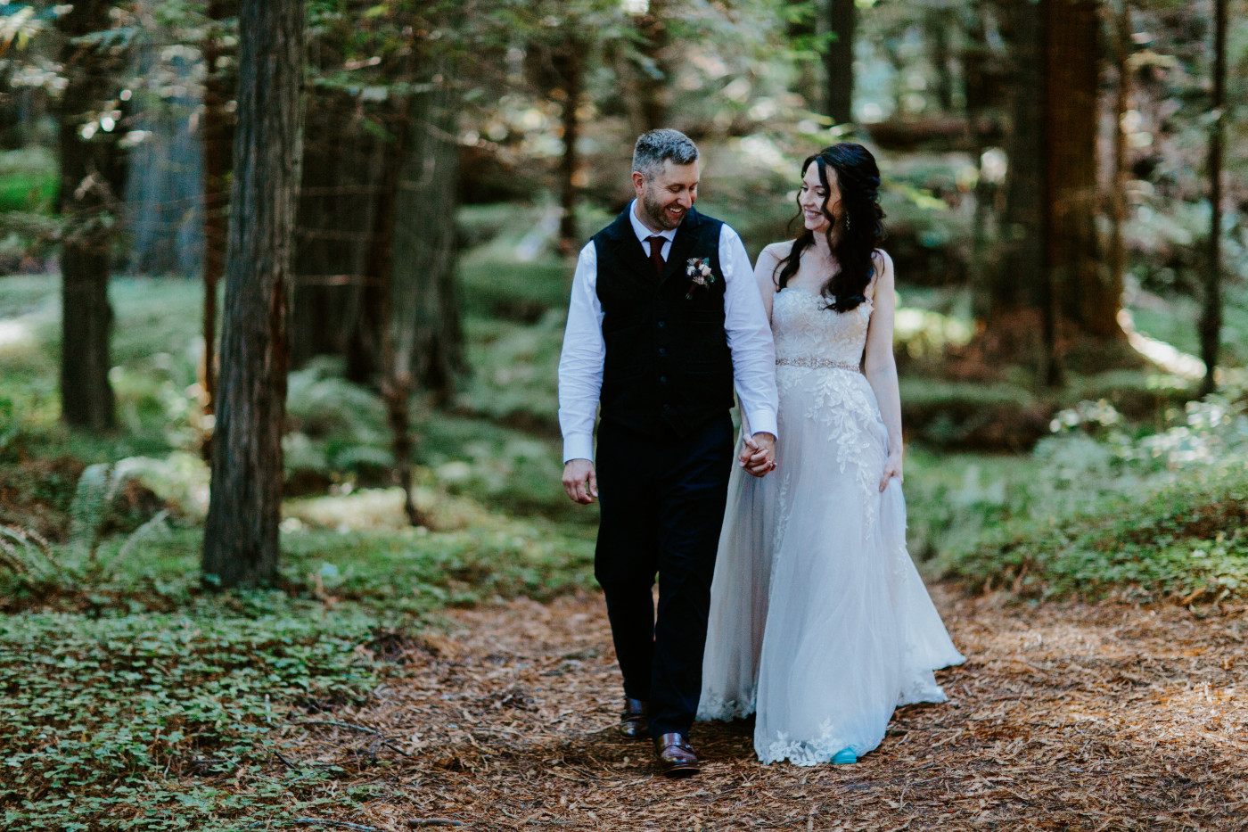 Tim and Hannah walk together, hand in hand.