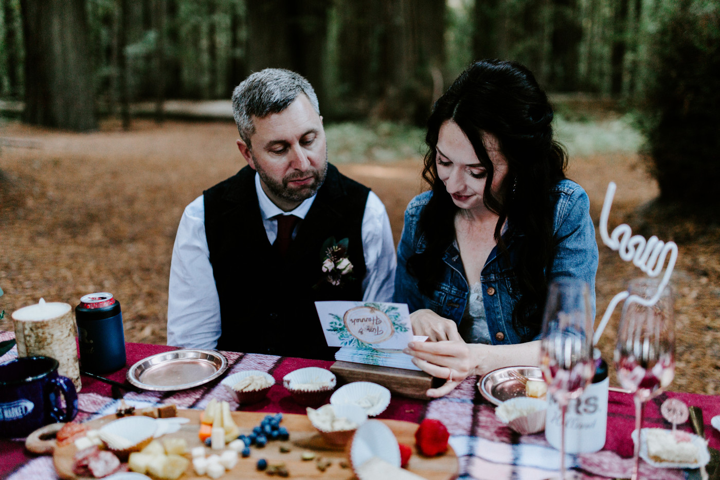 Hannah and Tim reading notes from their friends and family.