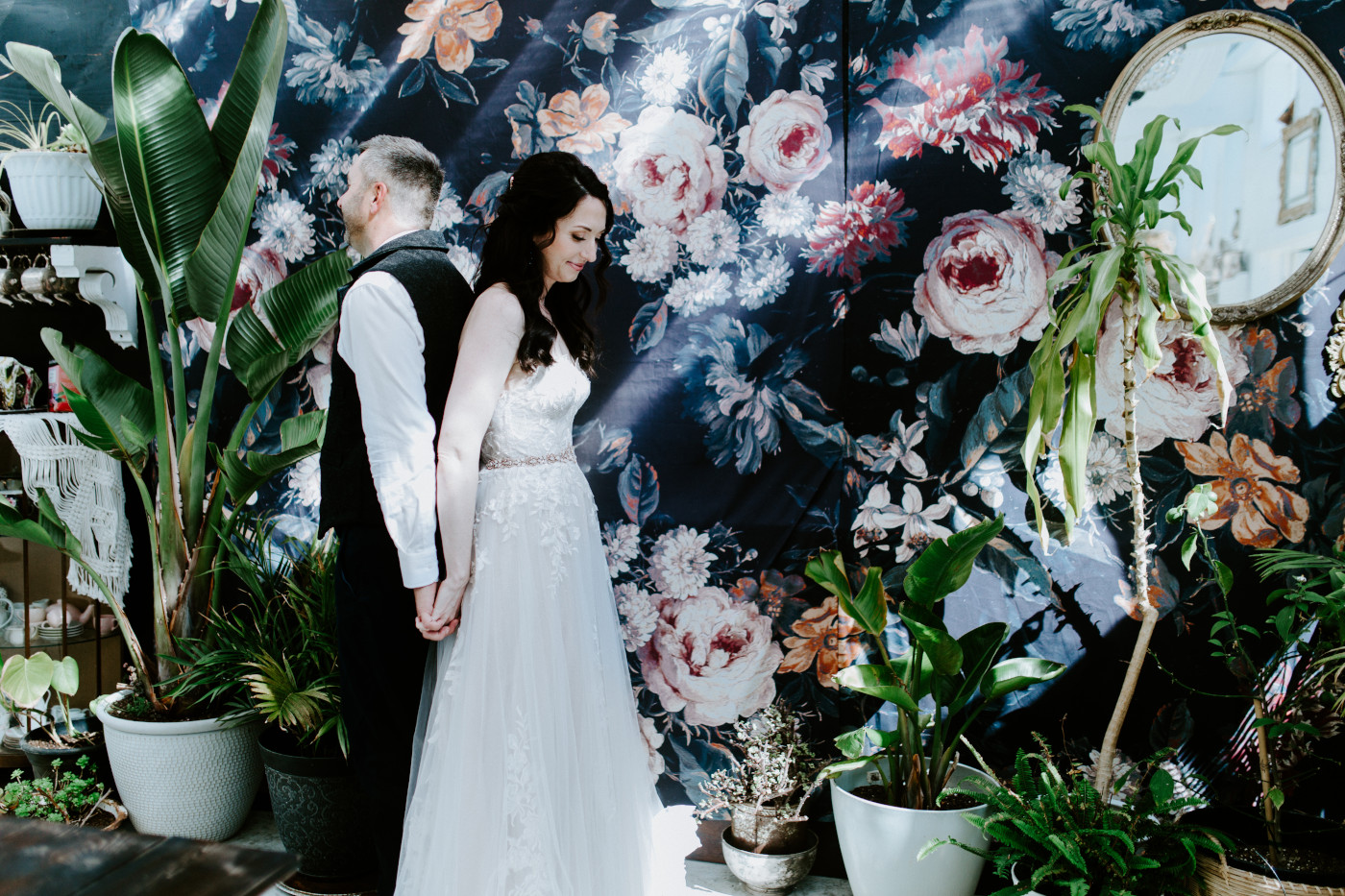 Hannah and Tim stand back to back for their firstlook.