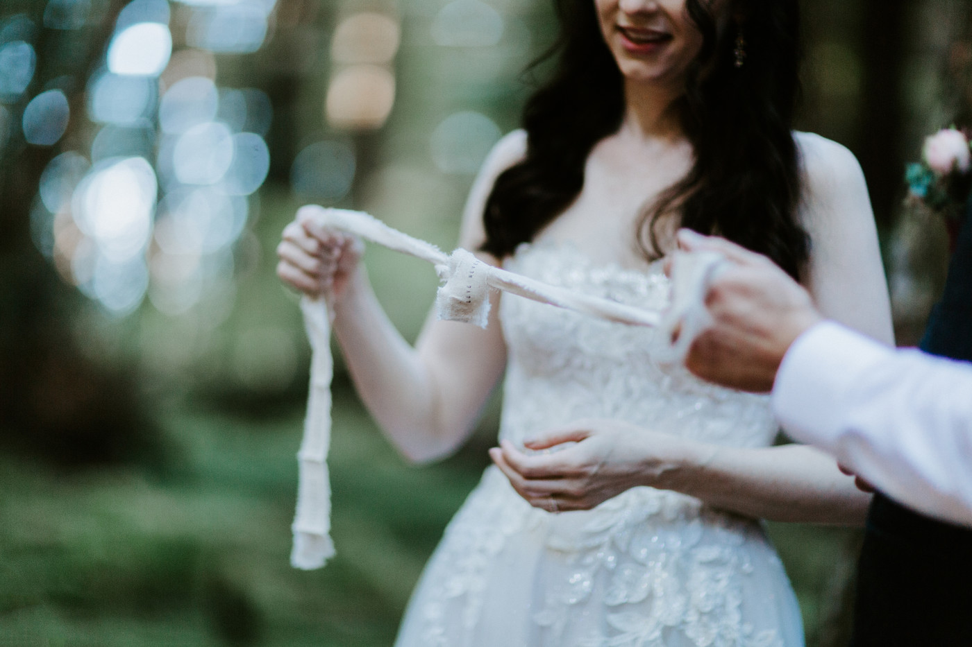 Hannah and Tim perform the knot tying ceremony.