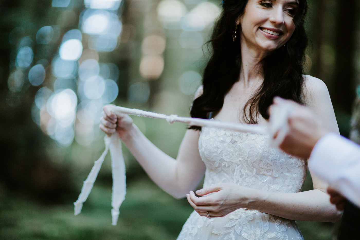 Hannah and Tim perform the knot tying ceremony.