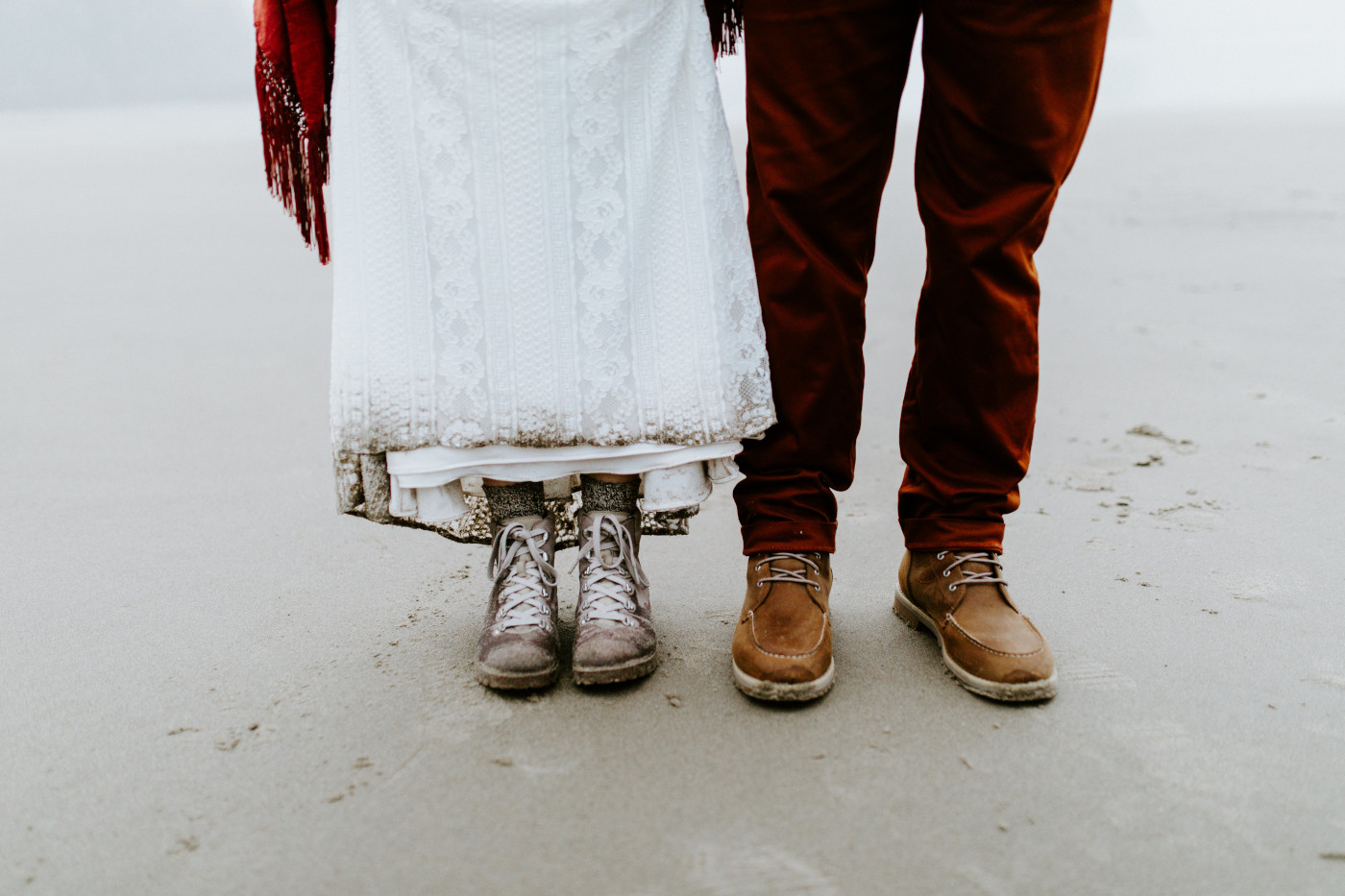 Allison and TJ's boots on the wet sand of Ecola State Park.