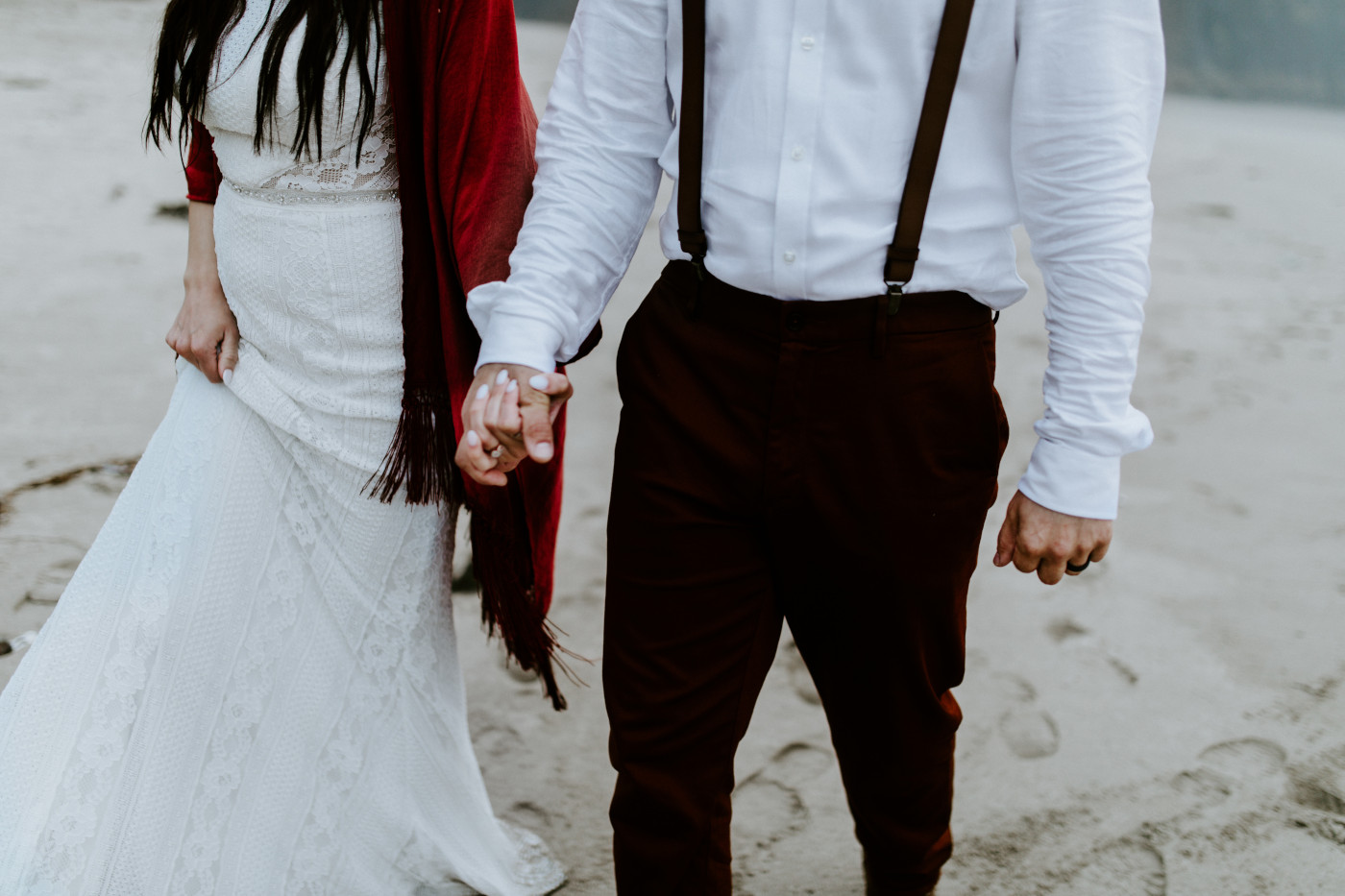 Allison and TJ walk hand in hand.