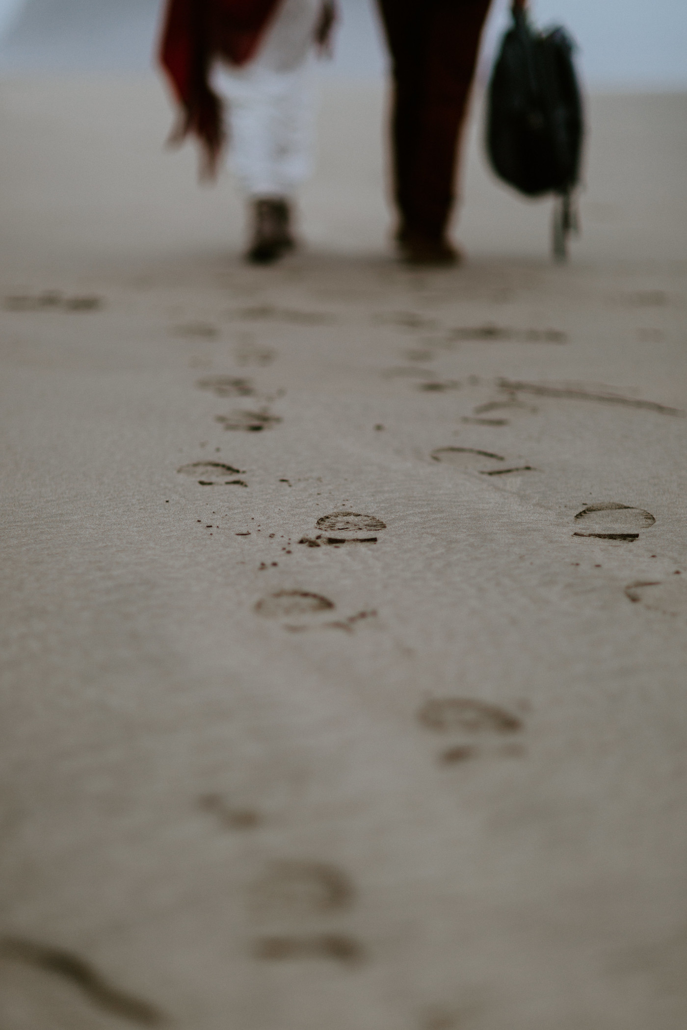 Footprints on the sand of Ecola State Park in Cannon Beach, OR.