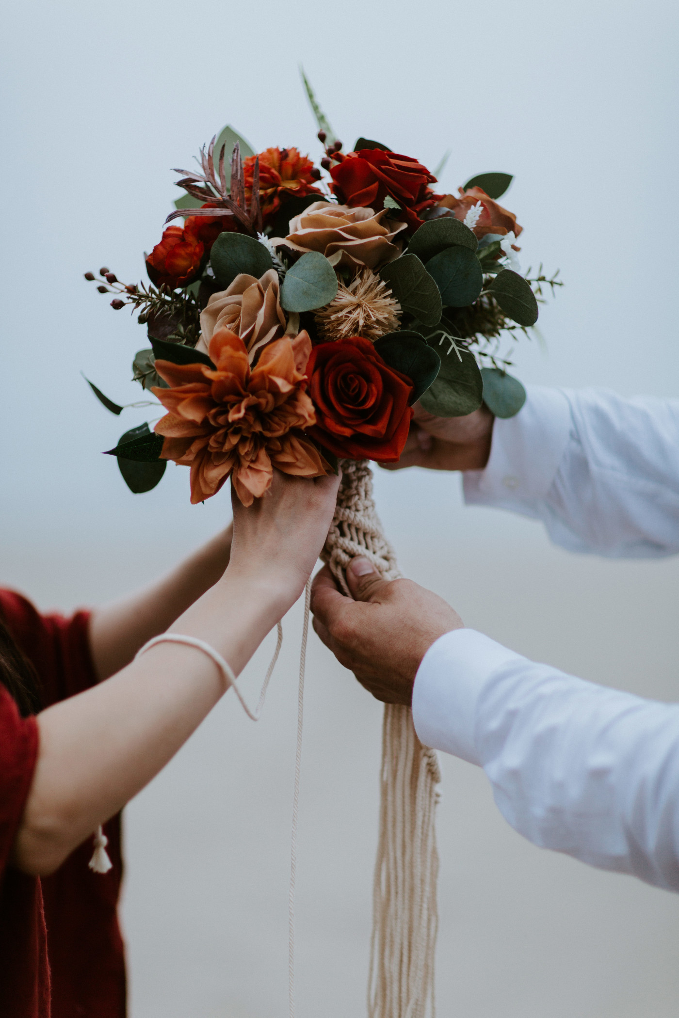 Allison adjusts her bouquet for her elopement.