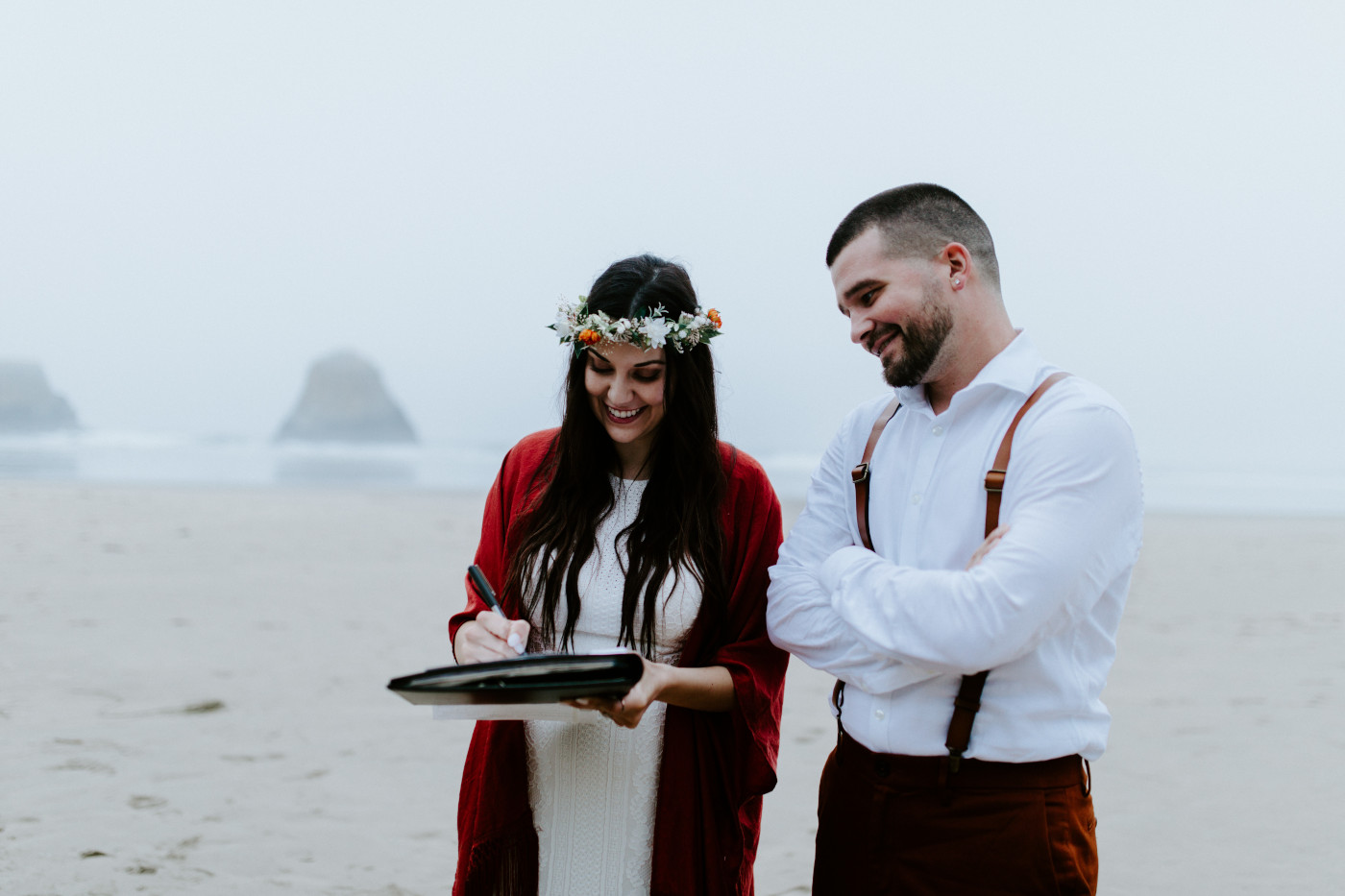 TJ and Allison sign their marriage certificate.