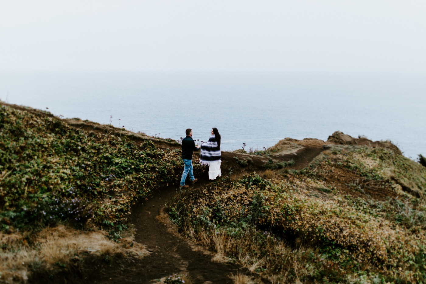 Alison and TJ make their way toward a cliff.