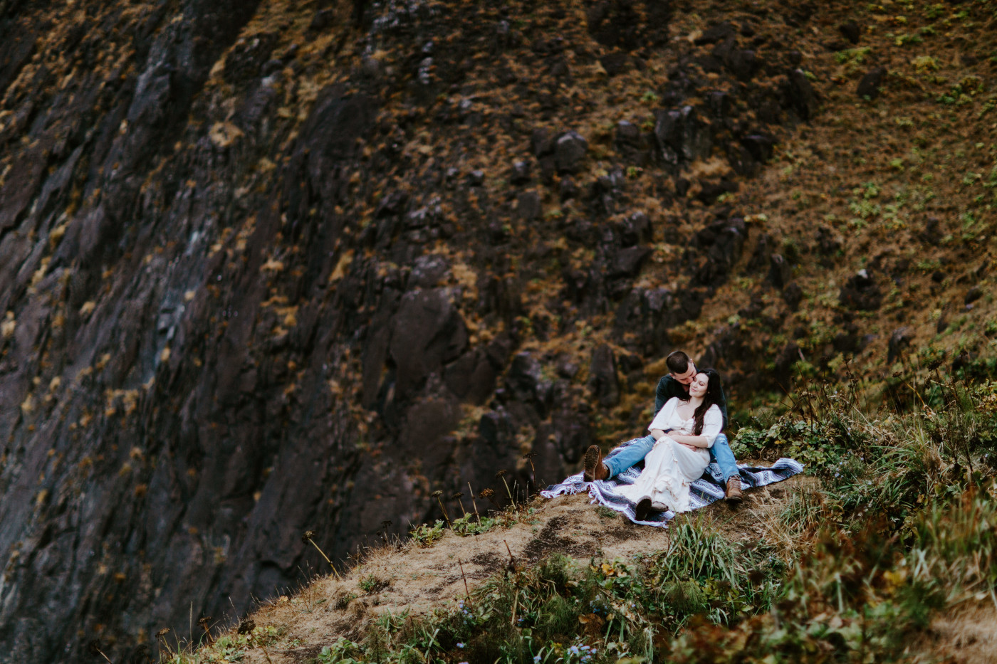 TJ kisses Allison near the cliff.