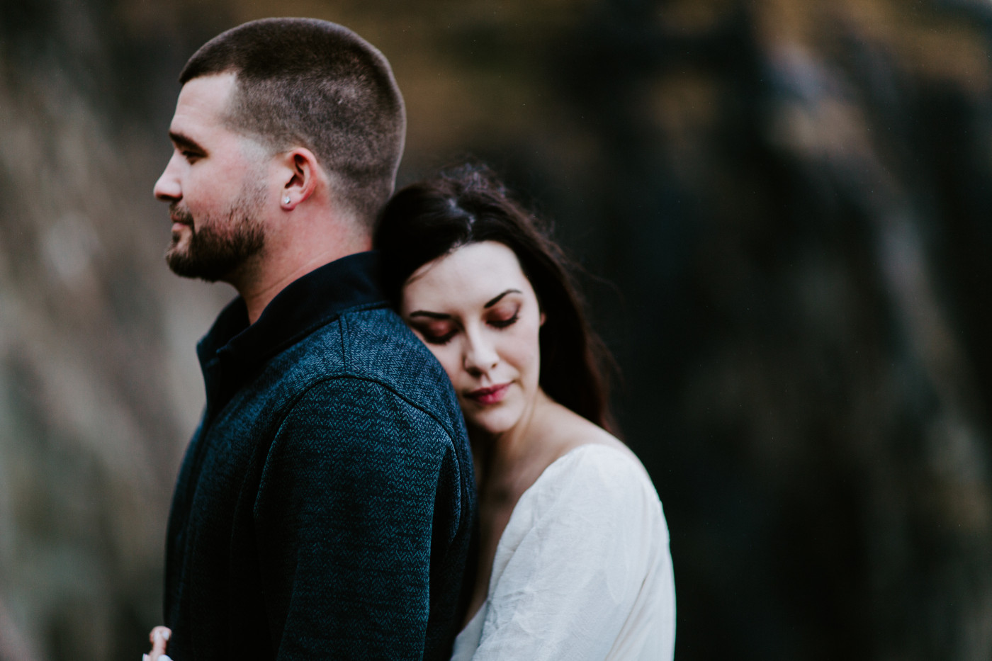 Allison and TJ stand for a hug.