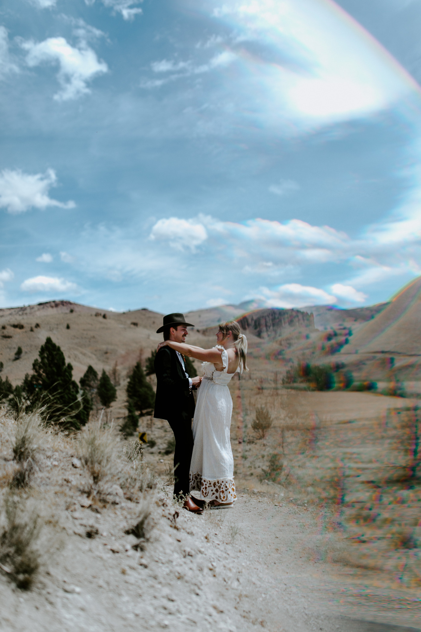 Emily and Greyson hug. Elopement photography in the Central Oregon desert by Sienna Plus Josh.