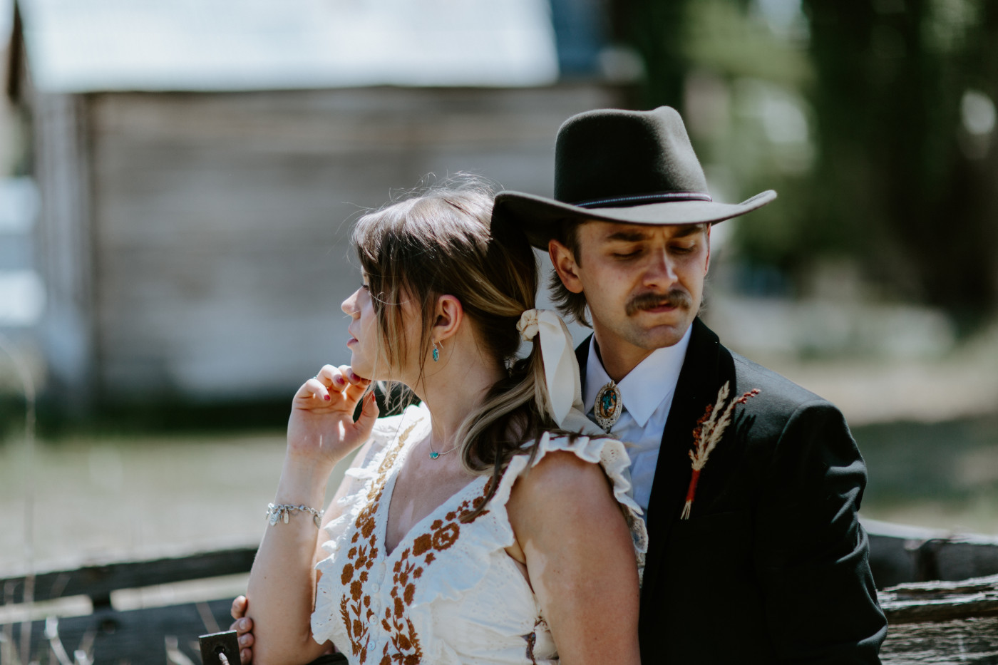 Emily and Greyson look off. Elopement photography in the Central Oregon desert by Sienna Plus Josh.