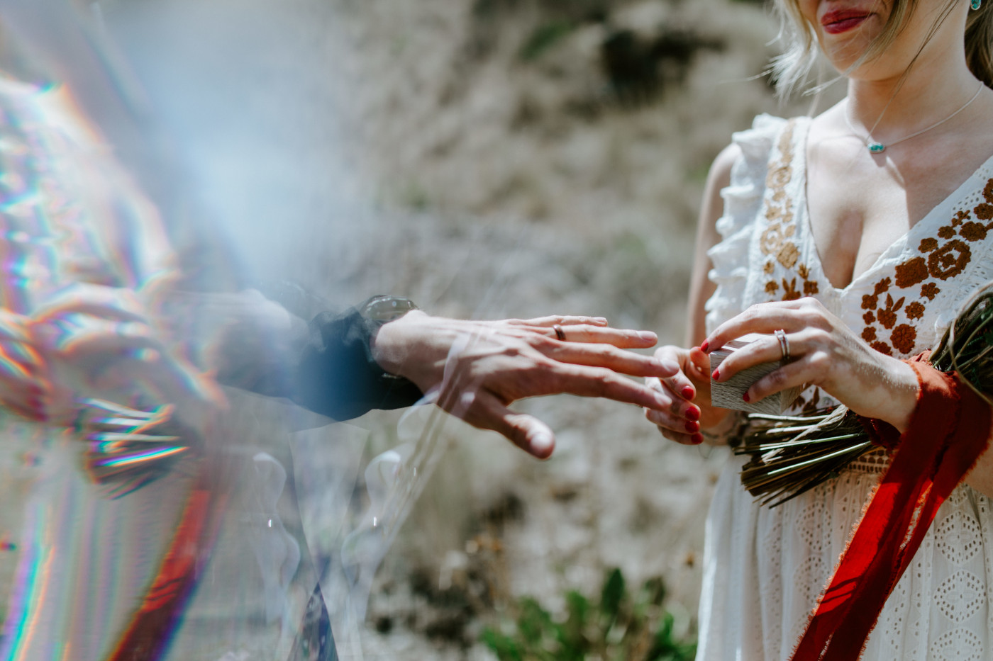 Emily puts a ring on Greyson. Elopement photography in the Central Oregon desert by Sienna Plus Josh.