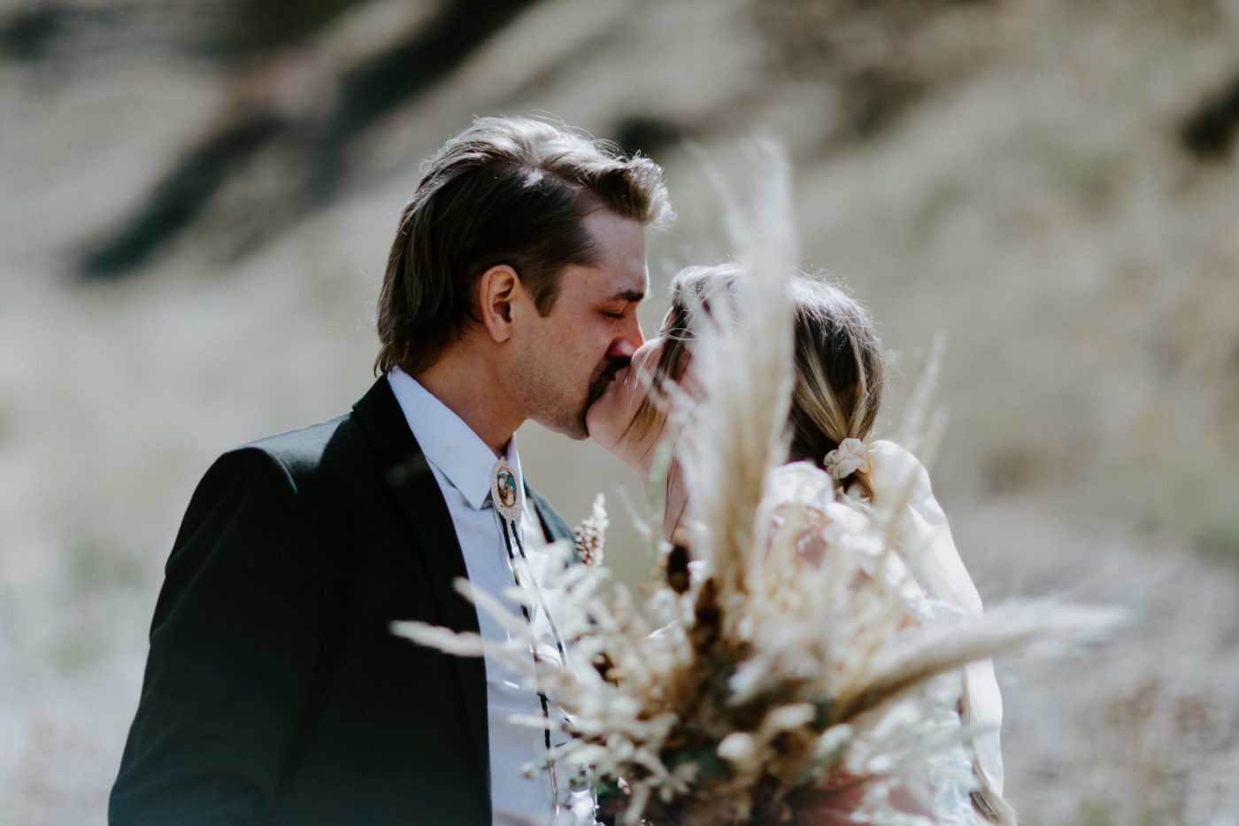 Emily holds Greyson's hand. Elopement photography in the Central Oregon desert by Sienna Plus Josh.