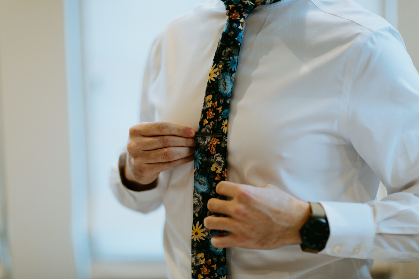 Lennie puts on his tie. Elopement photography at Columbia River Gorge by Sienna Plus Josh.