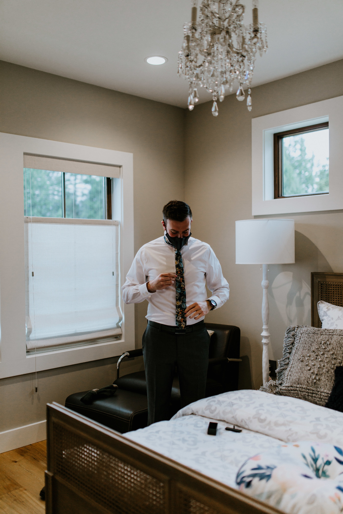 Lennie adjusts his shirt and tie. Elopement photography at Columbia River Gorge by Sienna Plus Josh.