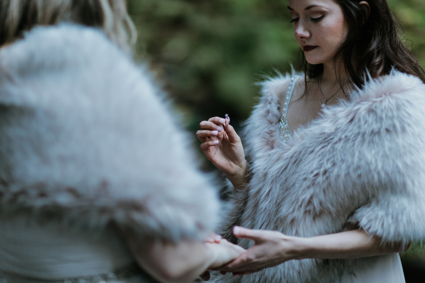 Hayley and Tiffany exchange rings. Elopement photography at the Columbia River Gorge by Sienna Plus Josh.