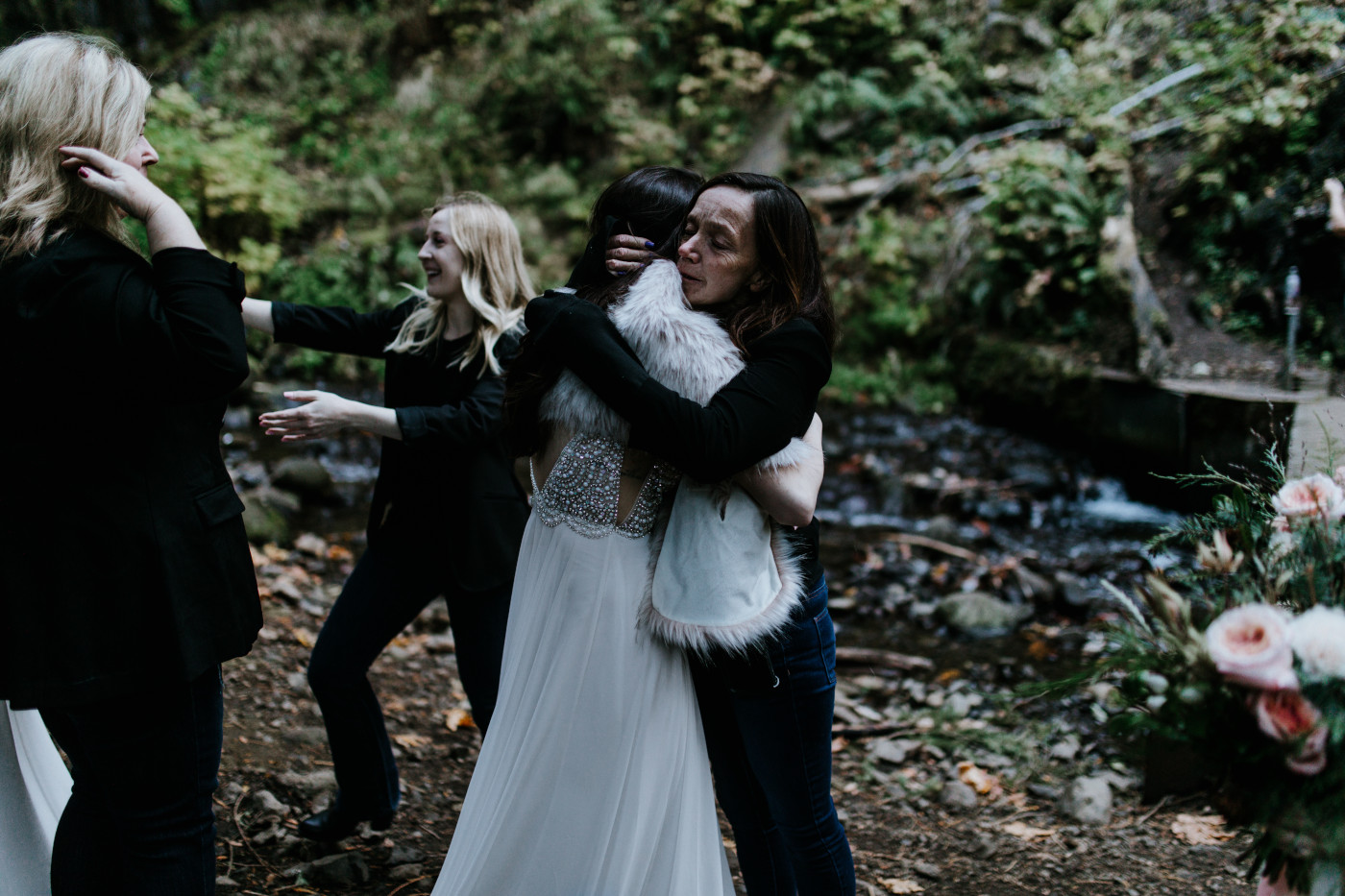 The brides hug family and friends. Elopement photography at the Columbia River Gorge by Sienna Plus Josh.