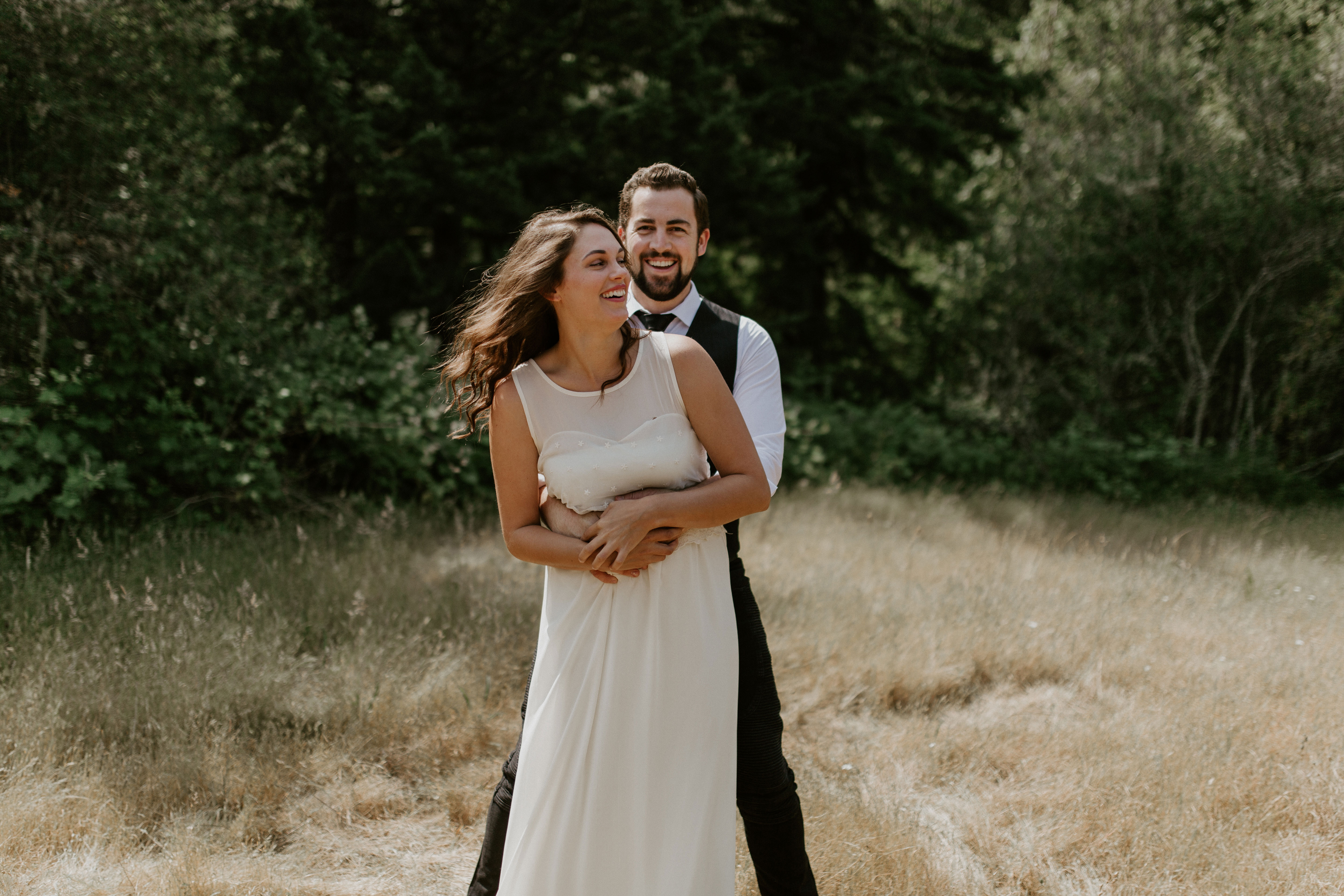Josh hugs Emily at the Columbia River Gorge in Oregon. Elopement photography in Portland Oregon by Sienna Plus Josh.