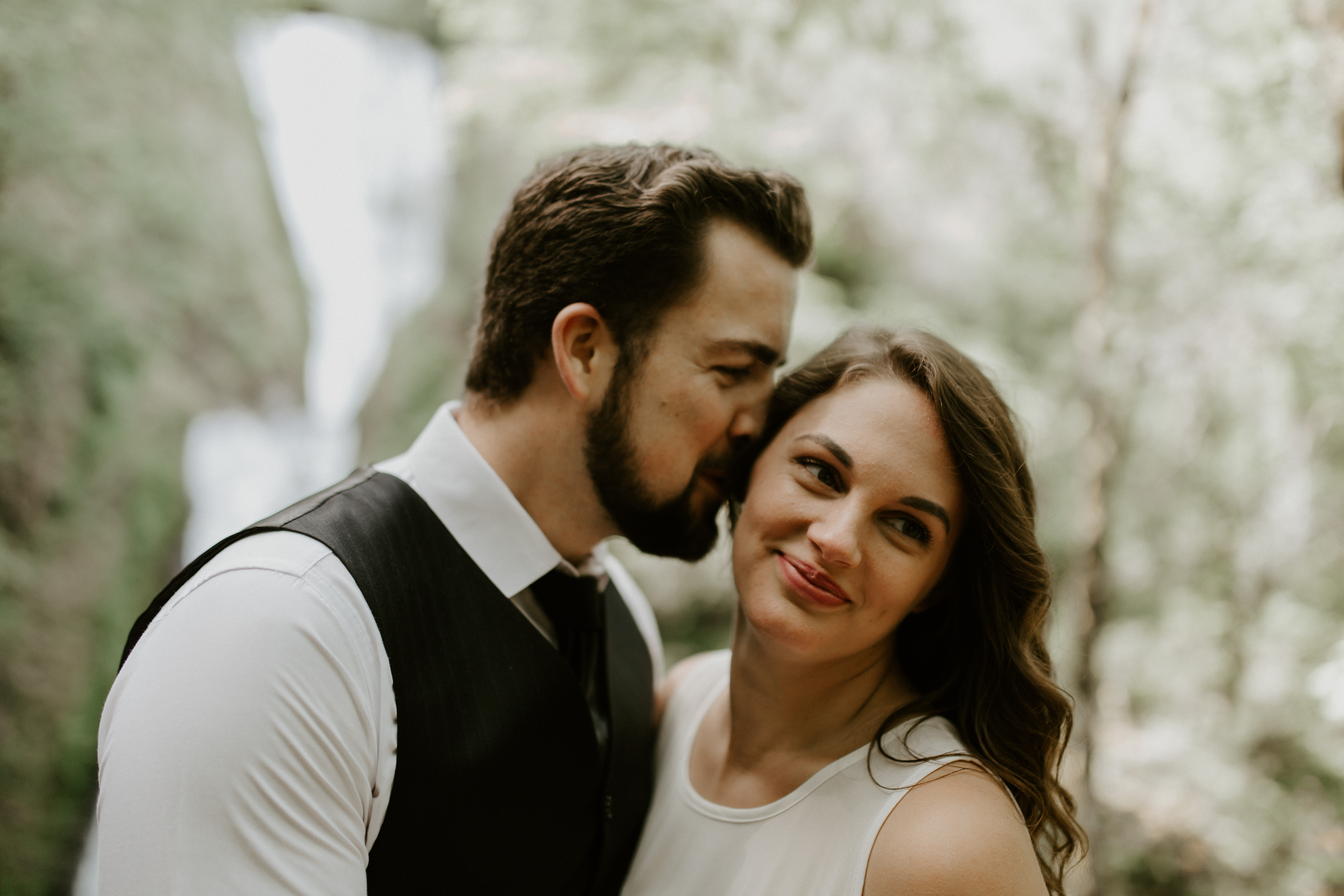 Josh and Emily hug at Bridal Veil Falls in Oregon. Elopement photography in Portland Oregon by Sienna Plus Josh.