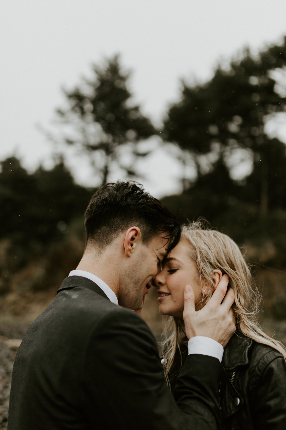 Hannah and Grant look each other in the eyes at Cannon Beach, Oregon. Wedding photography in Portland Oregon by Sienna Plus Josh.
