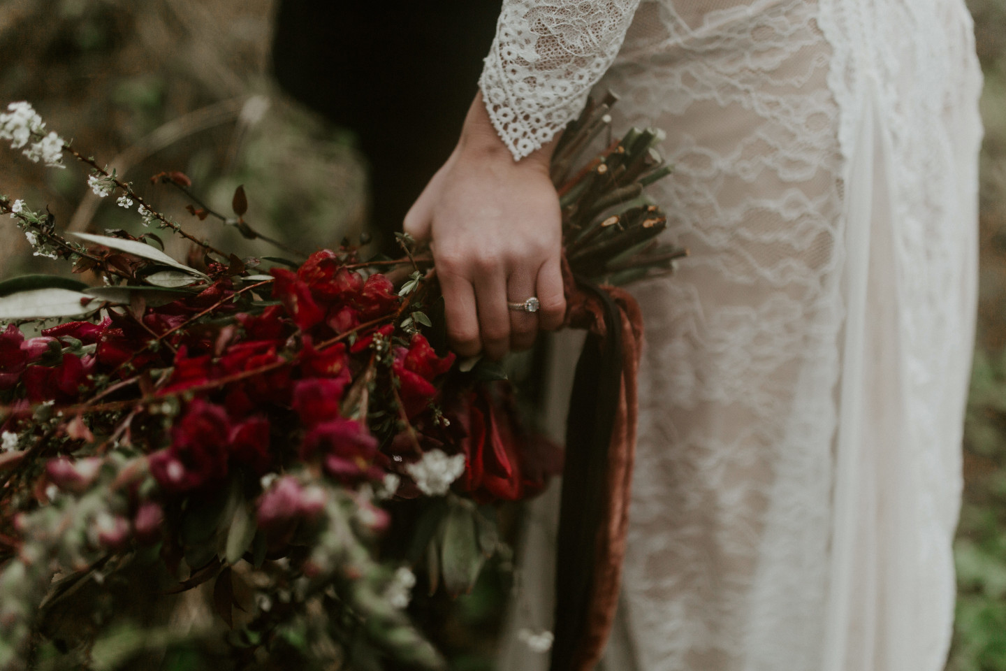 A close up of Hannah's ring and bouquet at Cannon Beach, Oregon. Wedding photography in Portland Oregon by Sienna Plus Josh.