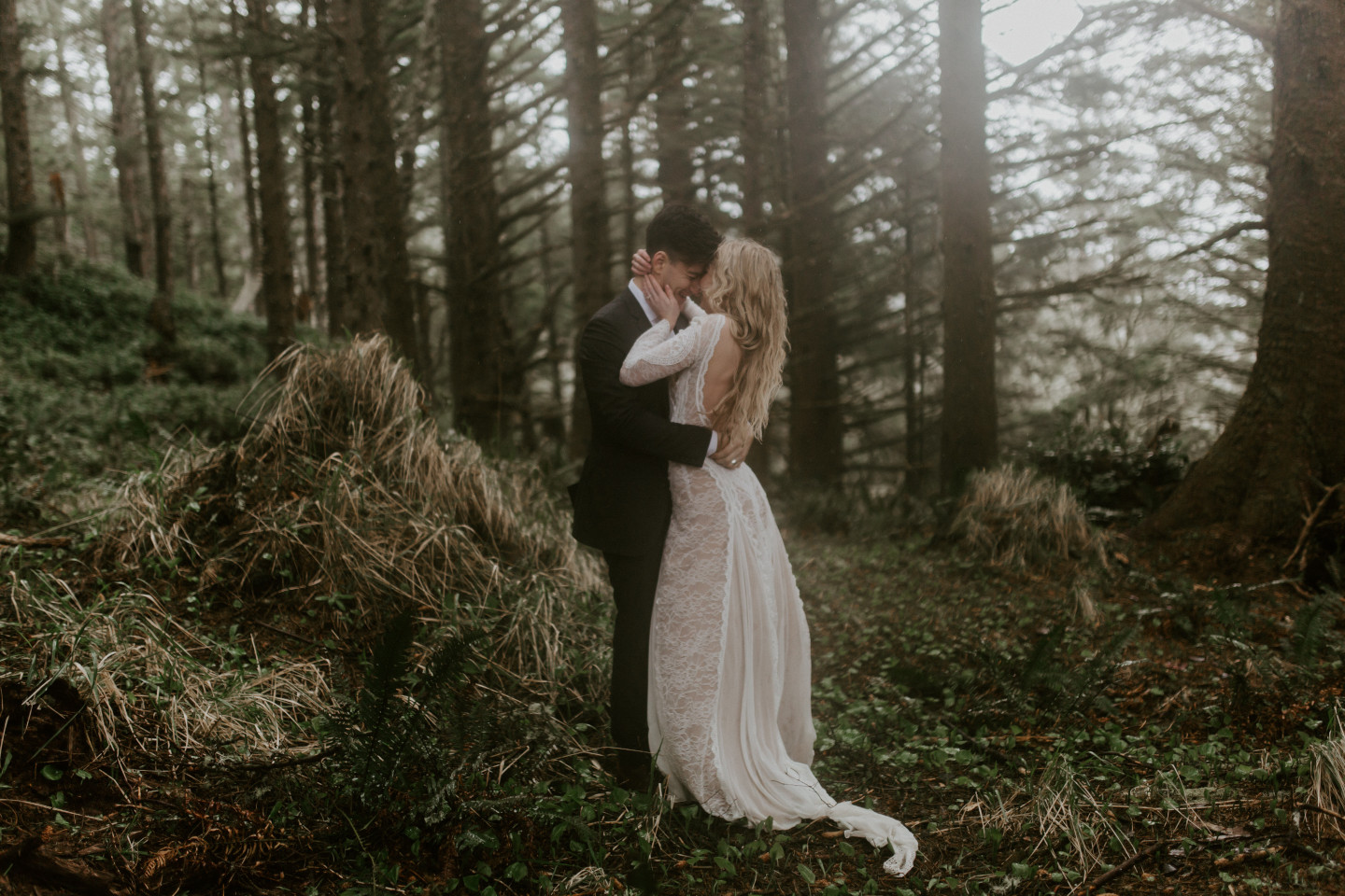 Hannah and Grant in the trees of Cannon Beach, Oregon. Wedding photography in Portland Oregon by Sienna Plus Josh.
